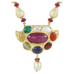 Classic Indian wedding jewellery, Navratna gold and diamond polki pendant