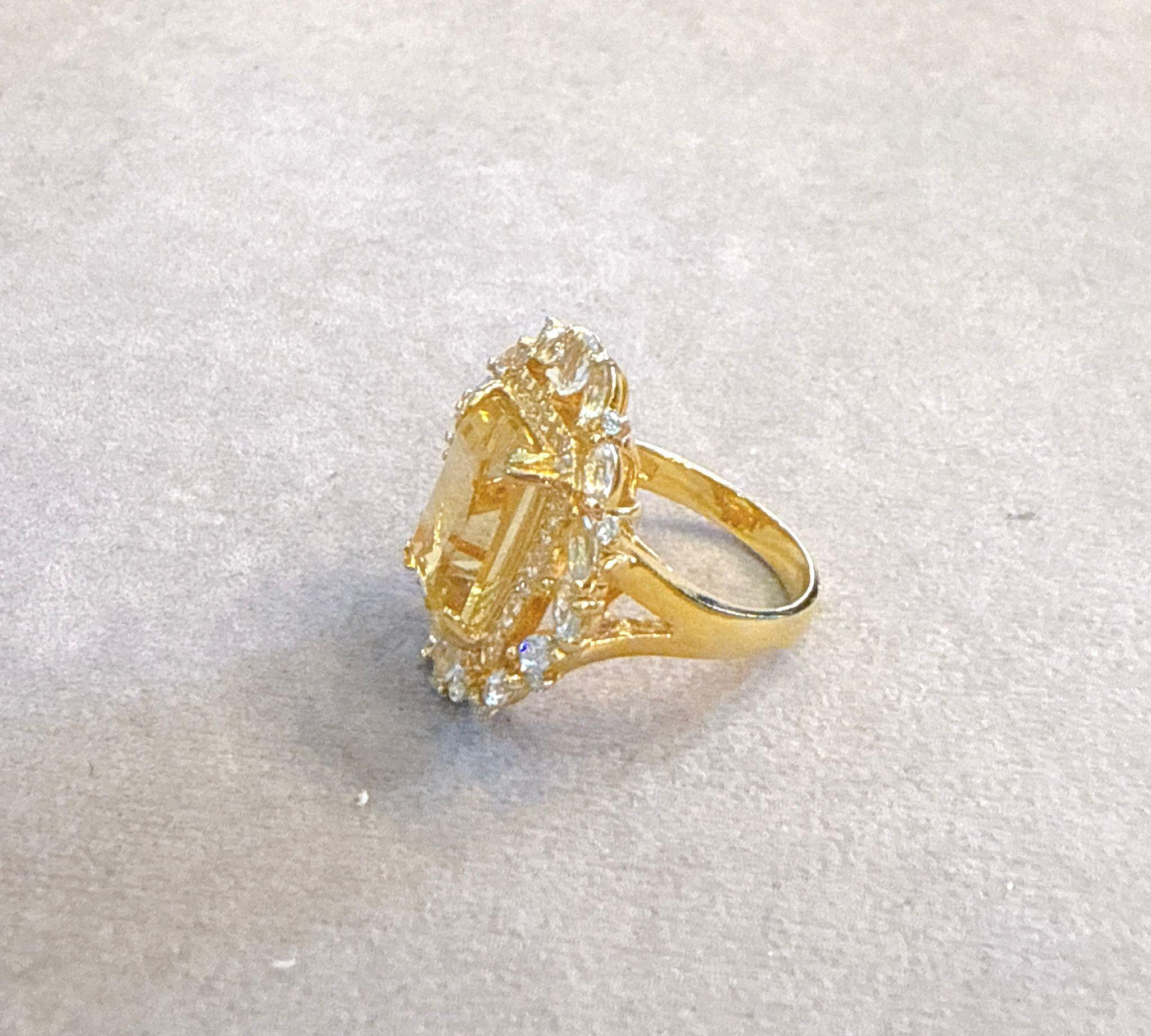 Classic Italian Bochic “Capri Lemon Topaz & Gem Ring Set In 18K Gold & Silver 

Natural Lemon Topaz, Emerald Cut Shape 
7.00 carats 
Natural Multi White & Blue Topaz
3.00 carats 

This Ring is from the 