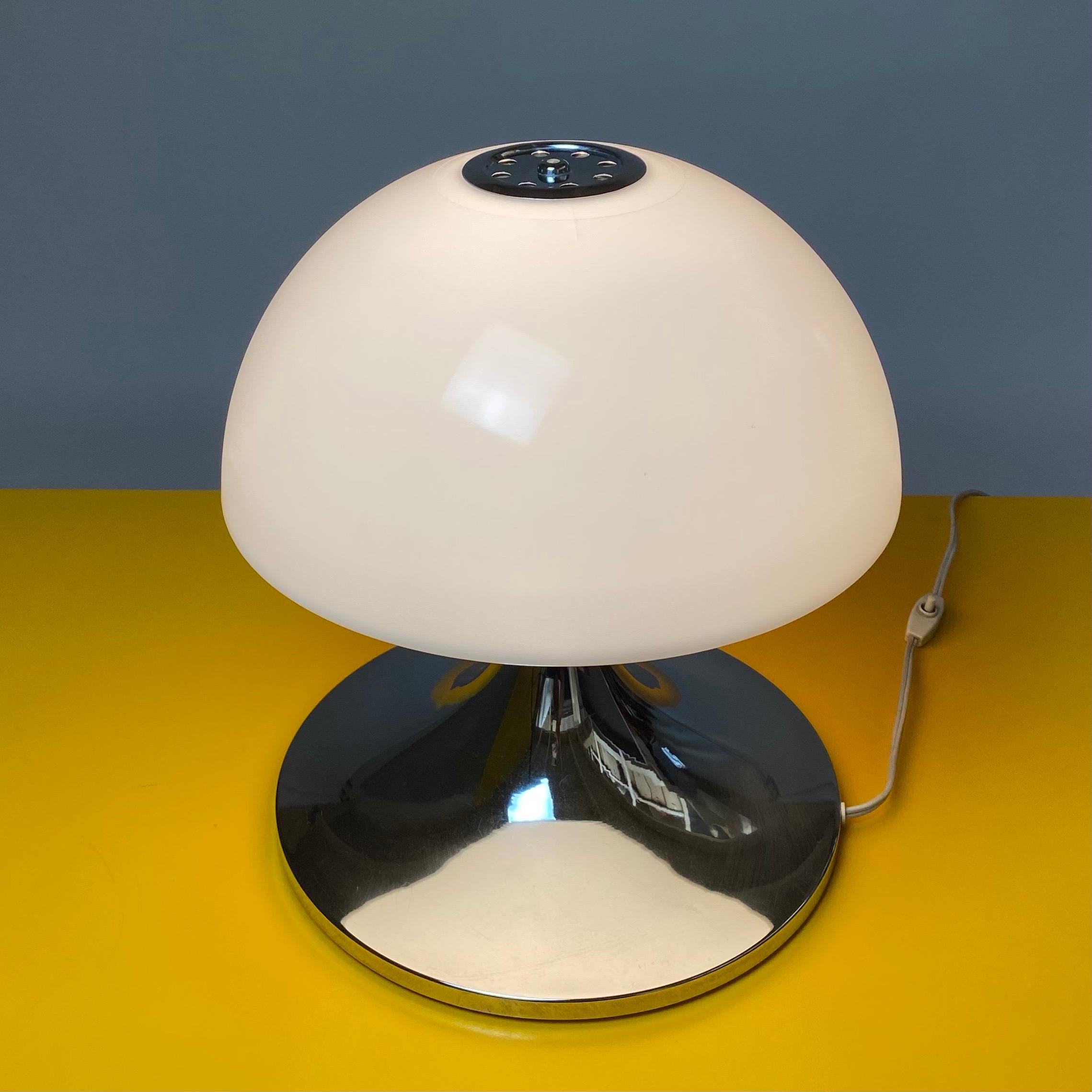 In style of Harvey Guzzini italian made large table lamp. 

Tulip shaped chrome base and milky white acrylic shade. 

All original and in excellent condition with few age related signs.

Light source: E27 / E26 edison screw fitting max 60W.