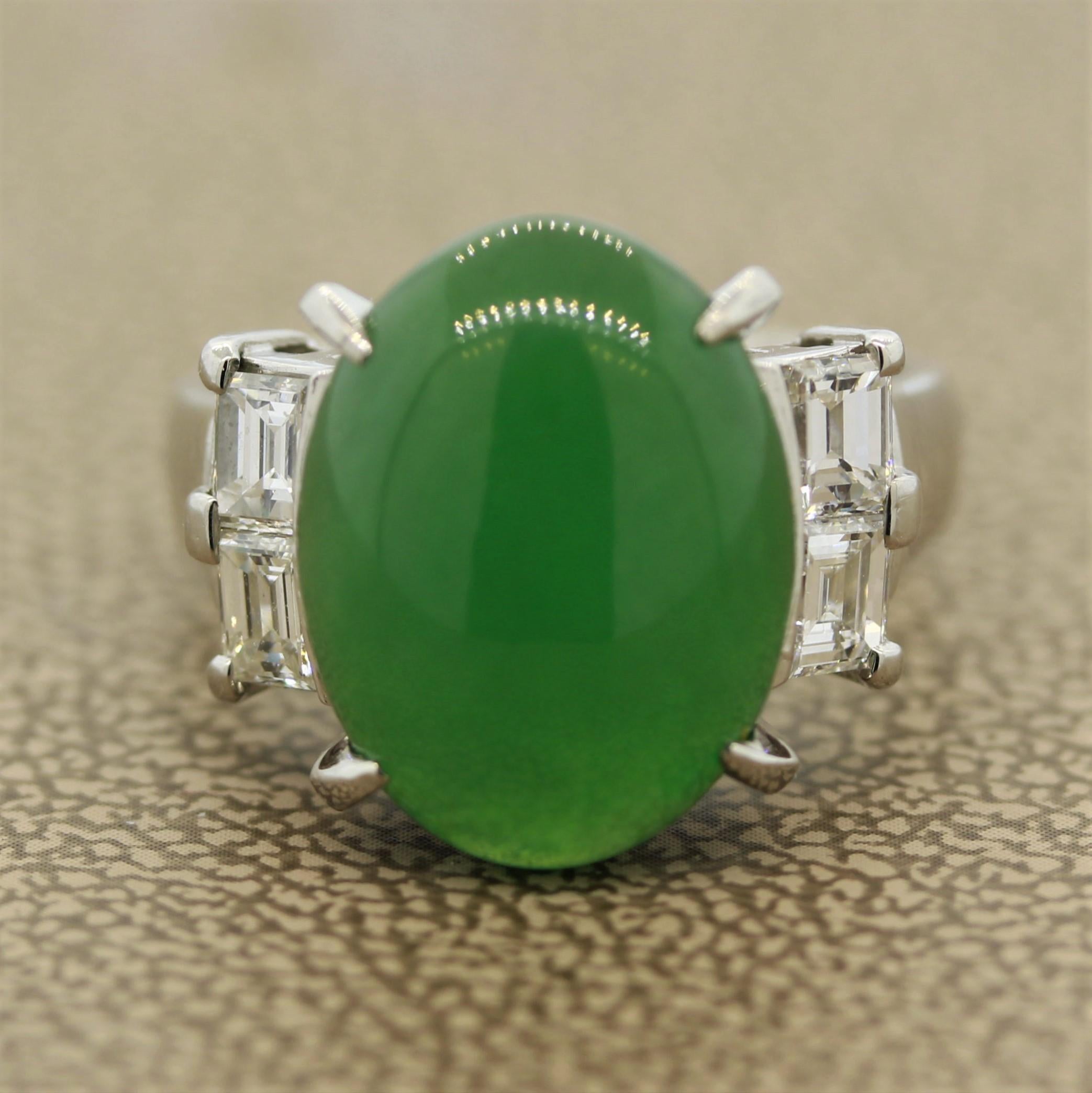 A classic natural Jadeite Jade ring set in a hand fabricated platinum mounting. The jade is polished as a beautiful smooth oval cabochon and weighs 7.30 carats. It is accented by 4 large baguette cut diamonds weighing a total of 0.79 carats. Type A