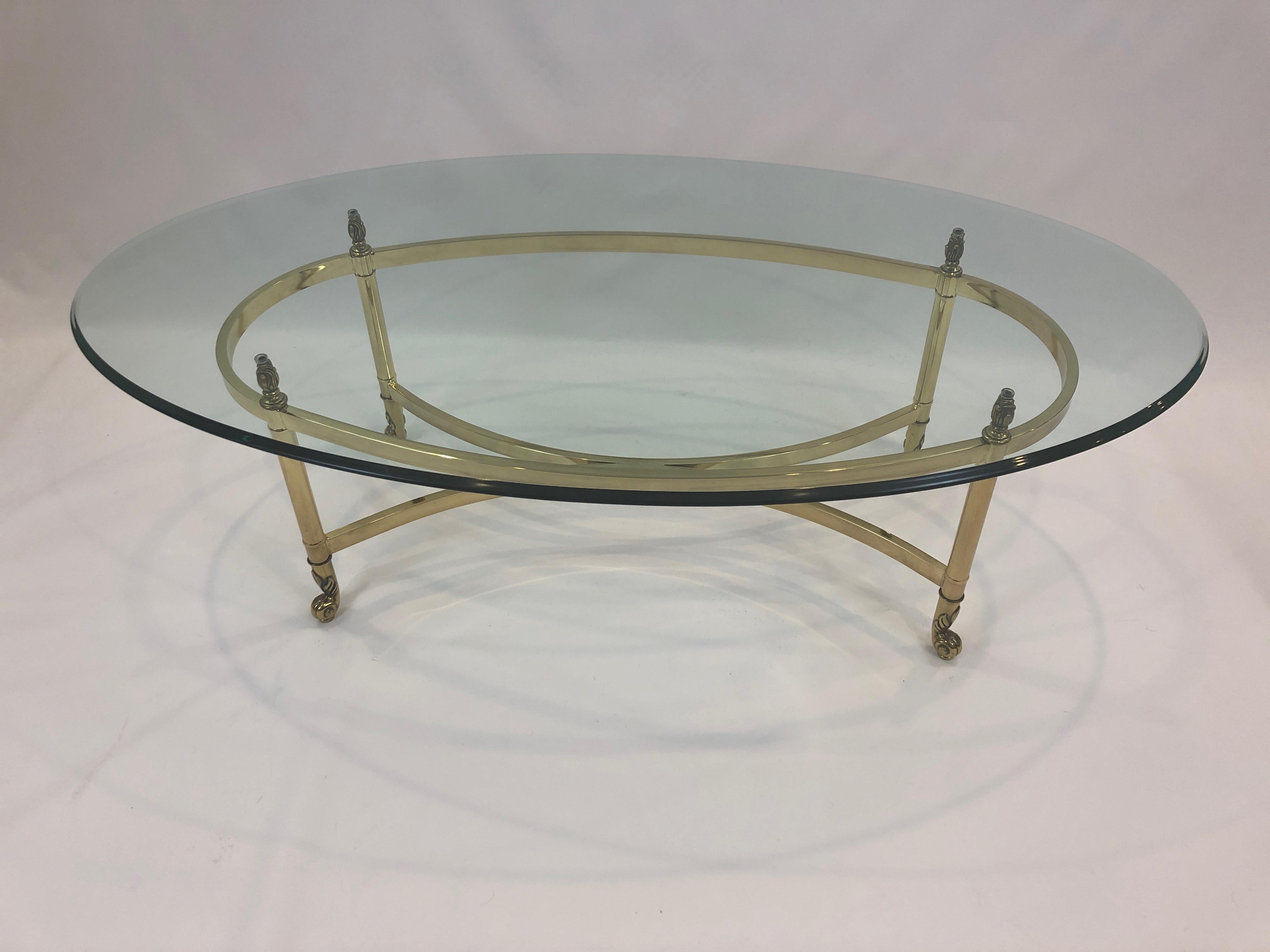 A solid and elegant oval glass coffee table with 1/2