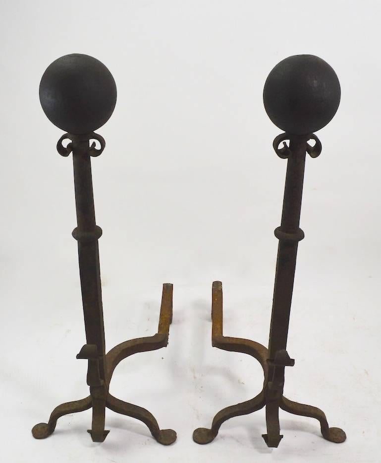 Large wrought iron cannonball andirons in very fine original condition, ready to use. Period Arts & Crafts, Mission metalwork, fine craftsmanship and impressive scale.