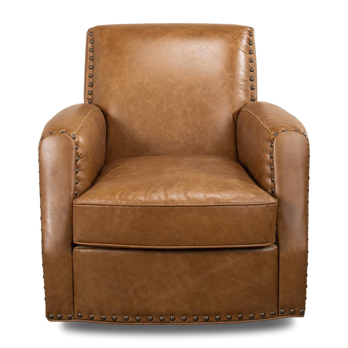 A Classic style Cuba brown leather upholstered armchair, upholstered with pure aniline top grade leather, with large nailhead details on a swivel base.

Dimensions: 32