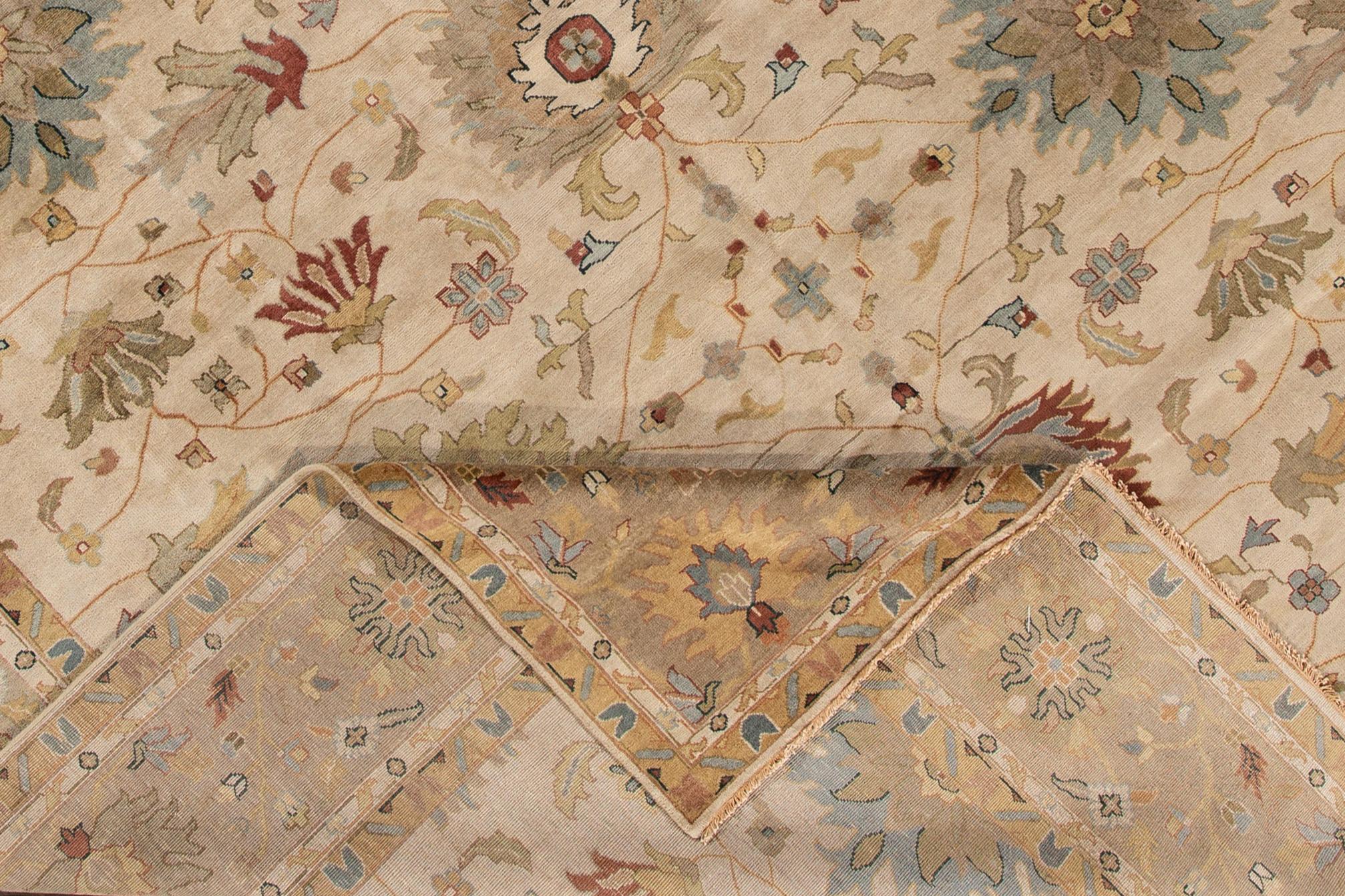 Beautiful oversize Mahal rug, hand knotted wool with an ivory field, tan and blue accents in an all-over classic motif.

 This rug measures 12' x 14' 10