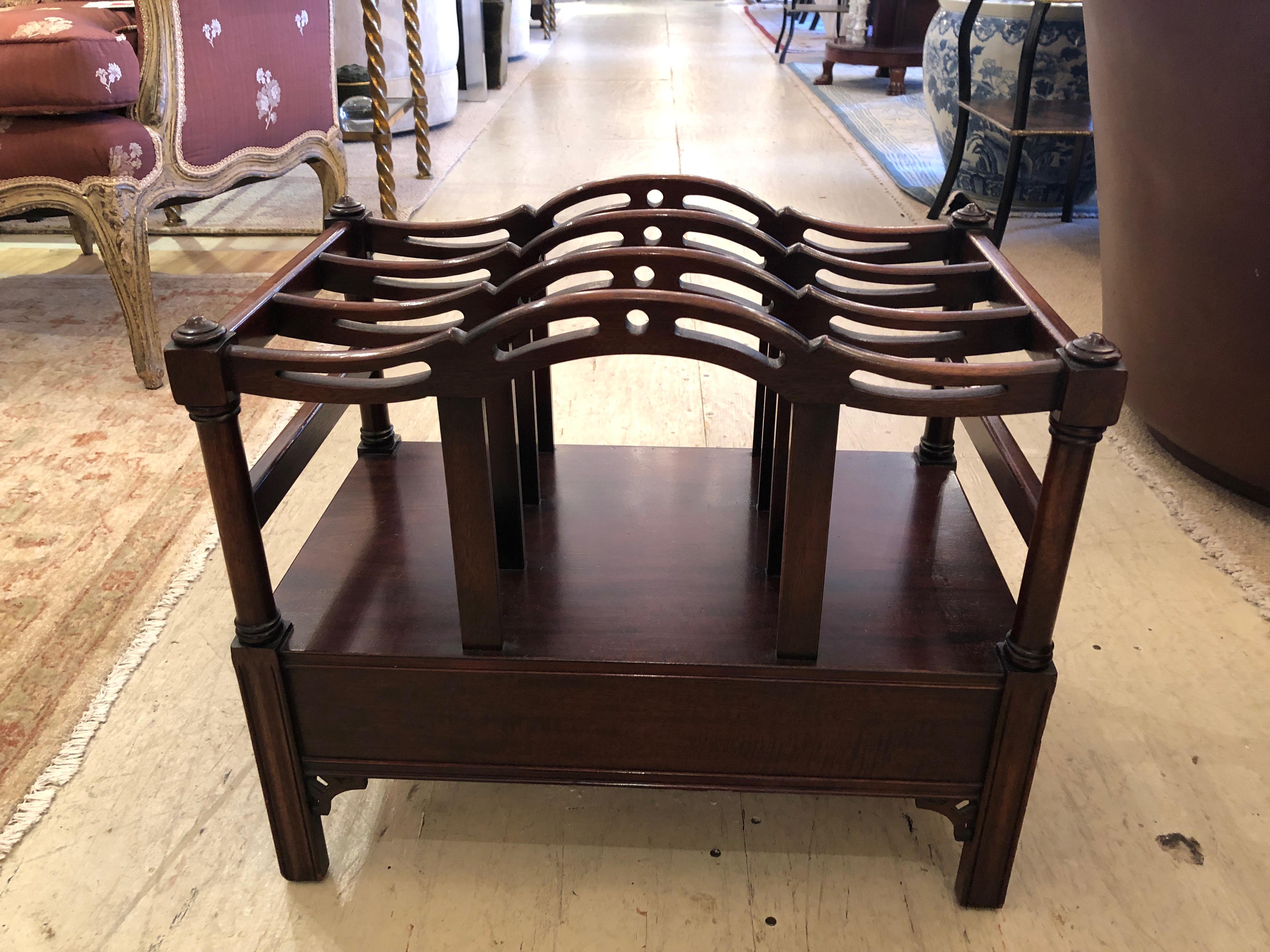 Classic and traditional mahogany magazine rack having Chippendale style, single drawer with handsome original hardware and label inside.