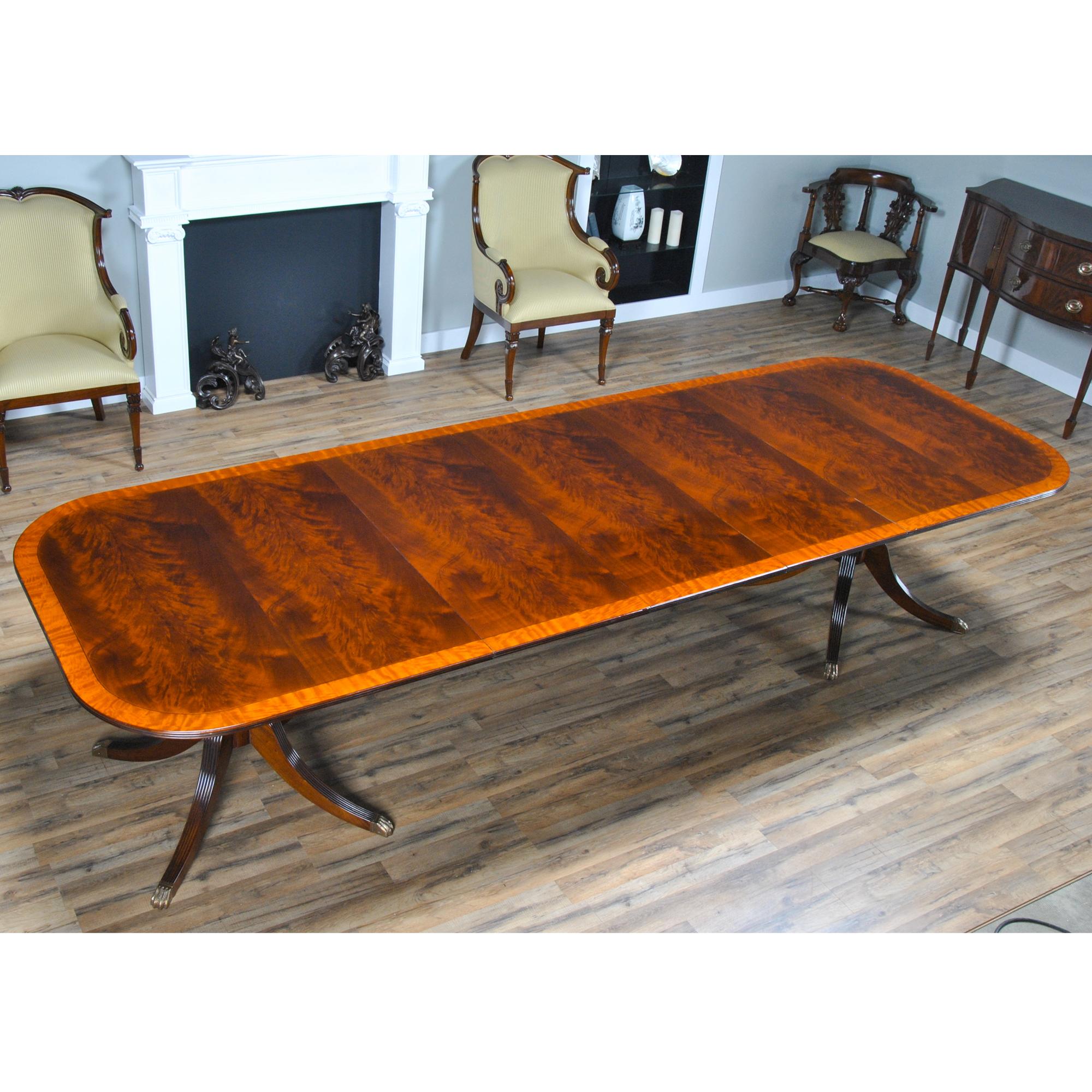 The Classic Mahogany Dining Table. We took many of our customers favorite features from different extension style dining tables and combined them into this one item. From the table top with it’s satinwood and pin stripe banding and the figured