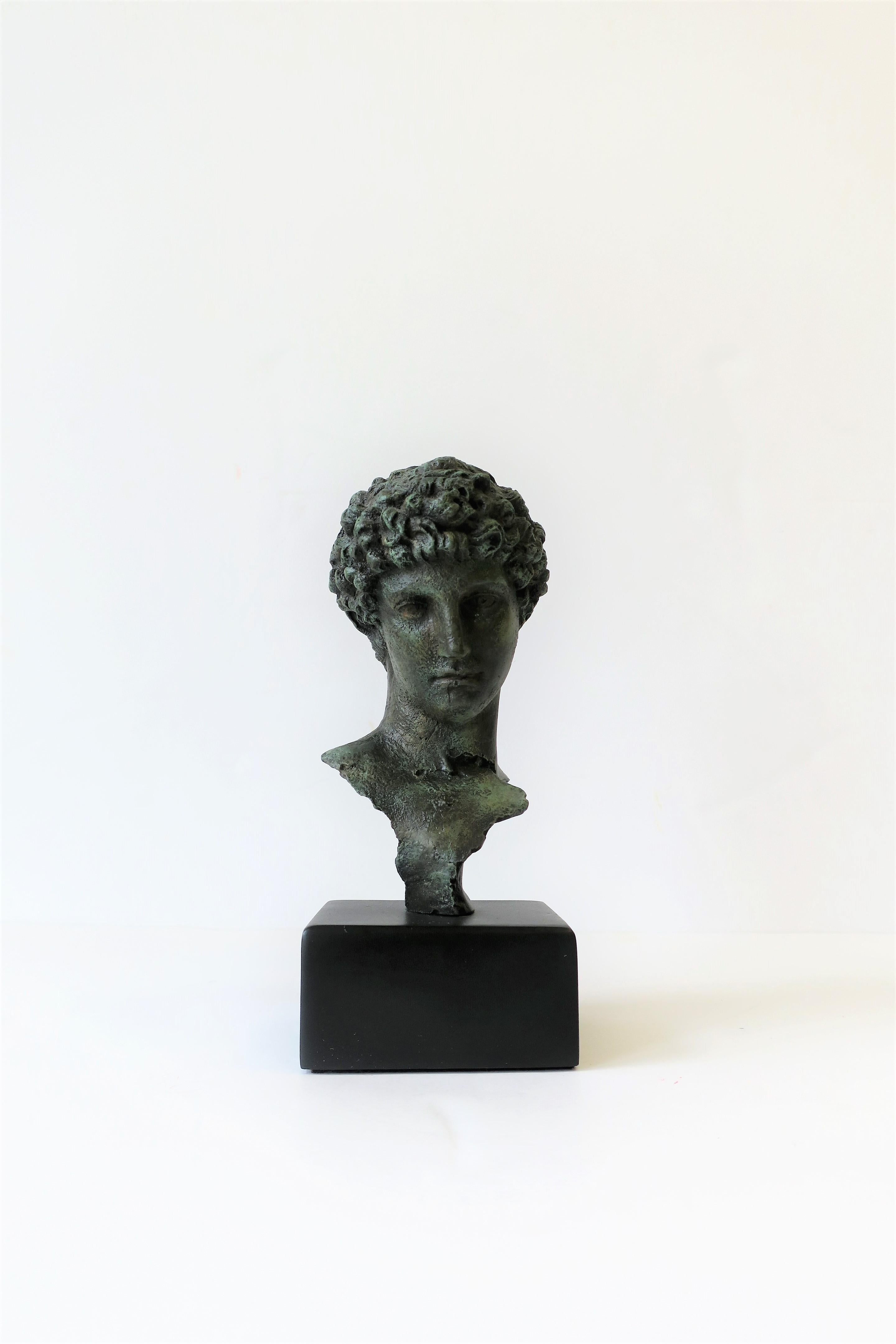A classical male bust sculpture piece on a black base. Excellent condition. 

Piece measures: 3.25 in. W x 3 in. D x 8 in. H.

 
