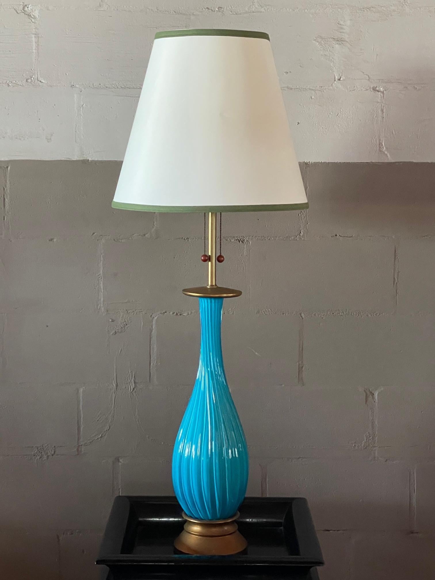 A beautiful Venetian ribbed glass lamp. Original base and fittings. Signed Venetian/Marbro.