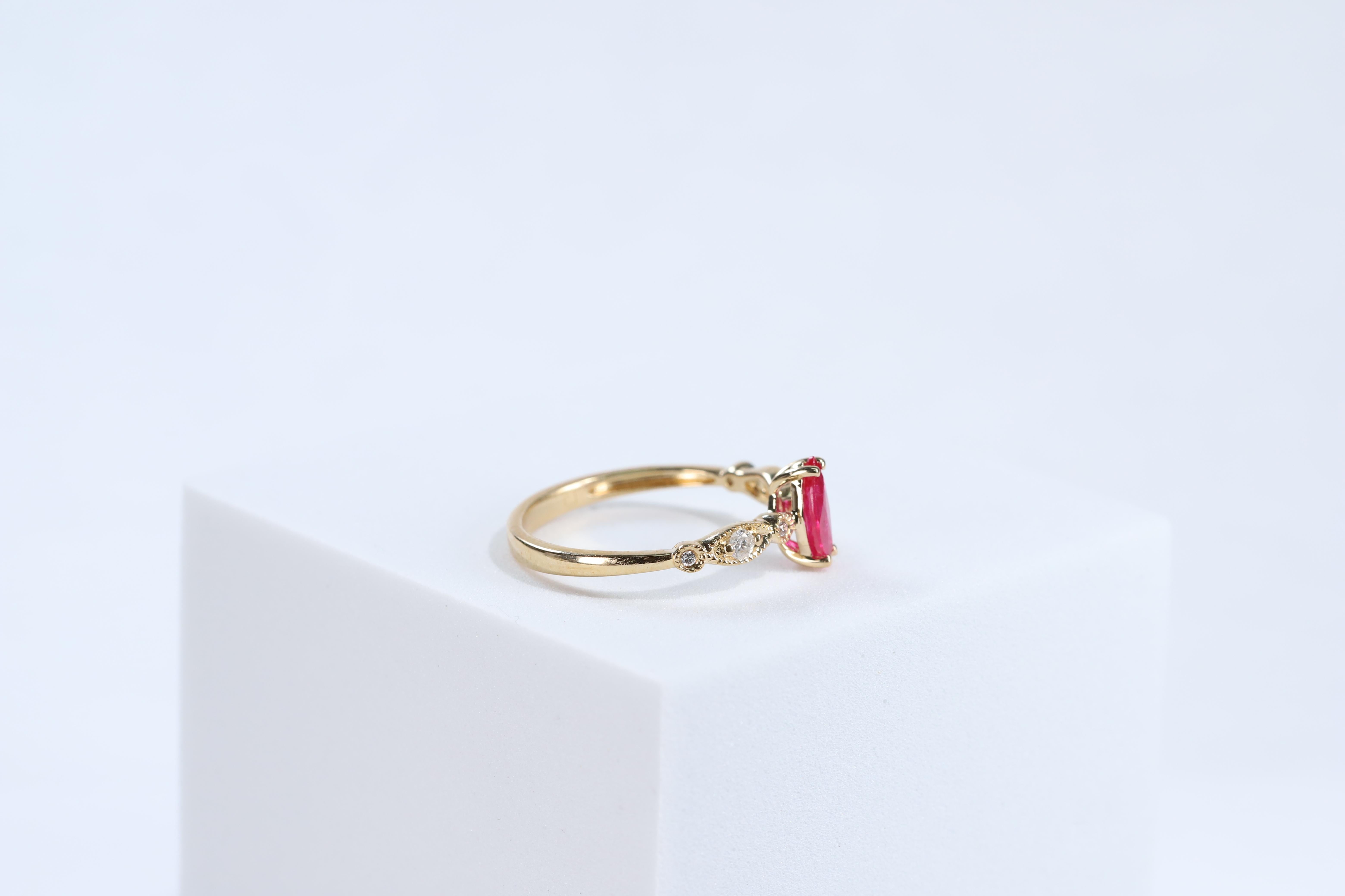 Classic Marquise-Cut Ruby with Round-Cut Diamond 10k Yellow Gold Ring In New Condition For Sale In New York, NY