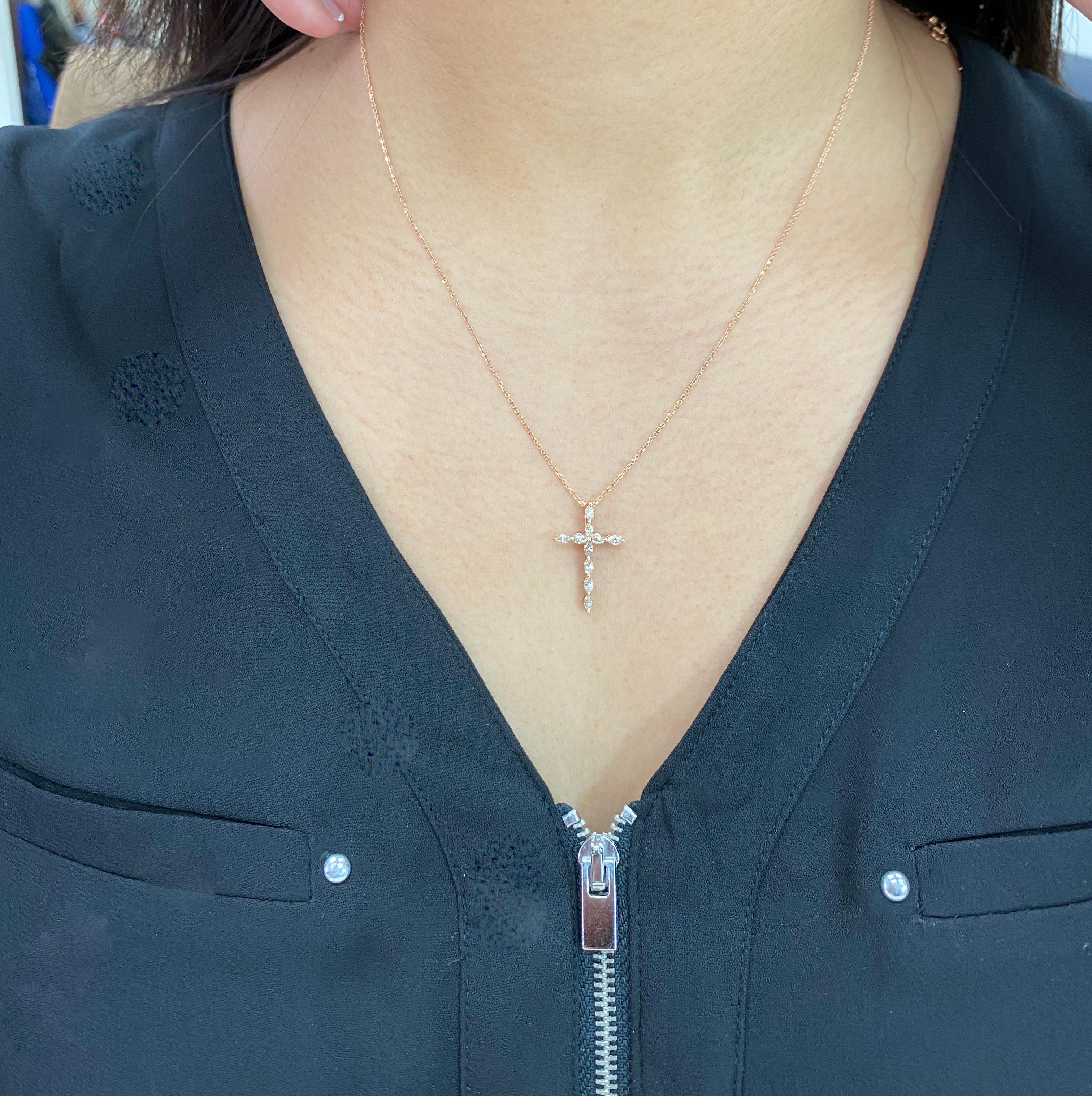 This is a beautiful classic cross pendant. It is set in 18k rose gold and diamonds. There are 10 Marquis shaped diamonds with a total carat weight of 0.60 cts that makeup this cross. An 18k rose gold chain will be included in this sale. This would