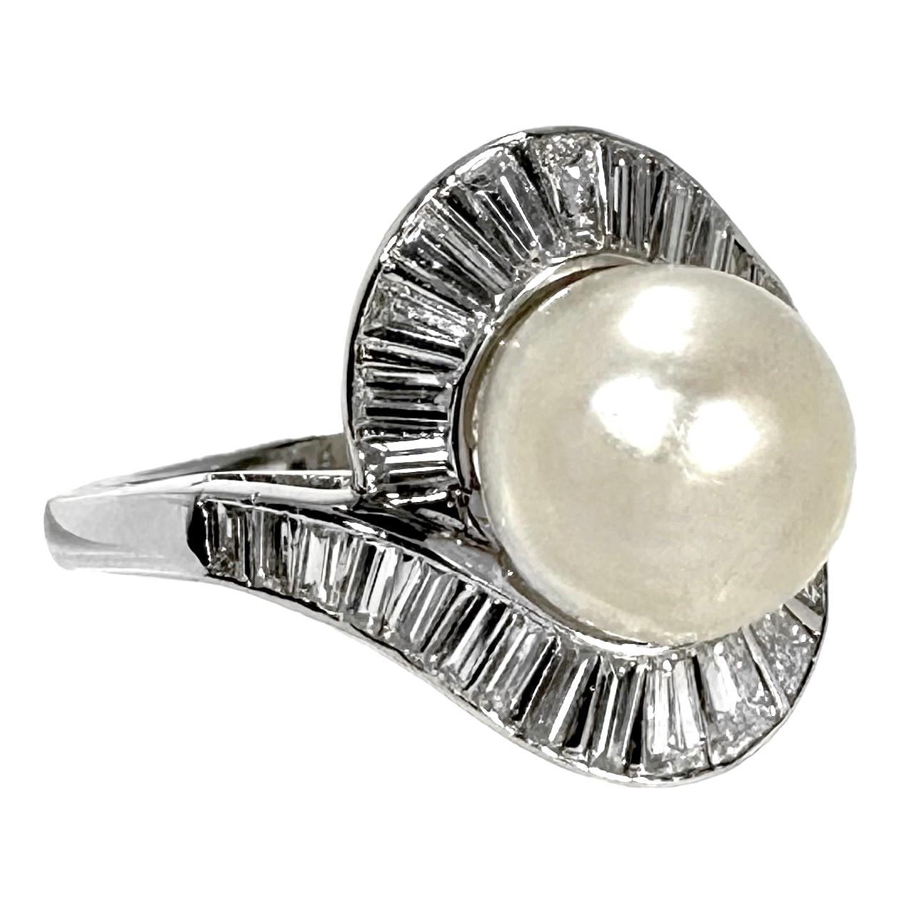 This lovely hand crafted  platinum cocktail ring is most certainly a creation of the 1950's to 1960's. During this period pearls were used extensively as center pieces as well as minor decorations in all manner of jewelry. The center natural