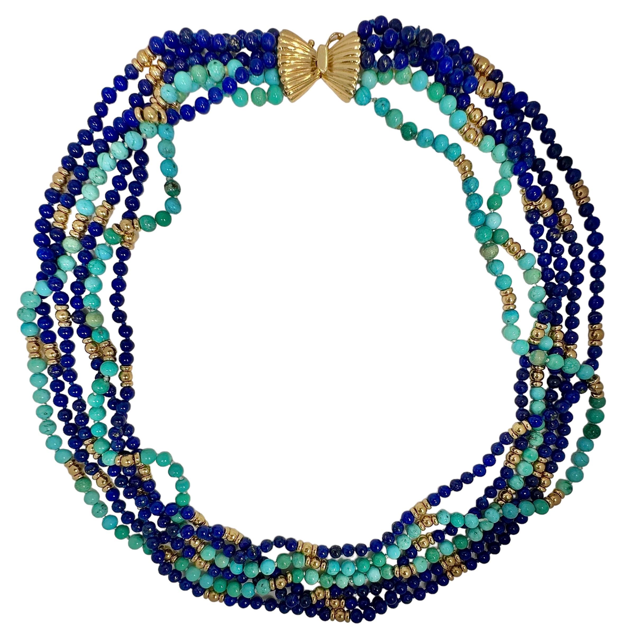 This Classic Mid-Century choker length torsade necklace is a true classic in style and in the materials used to fabricate it. Two 4.5mm, bright, natural turquoise strands are grouped with four 4mm, rich blue strands of lapis-lazuli. When worn as a