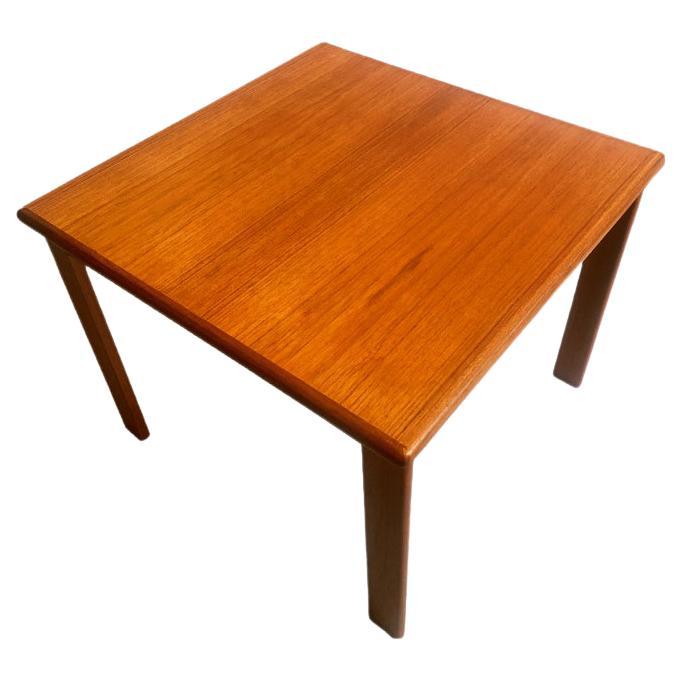 These two small and elegant coffee tables are classic Danish mid-century design. Glowing teak and somehow 