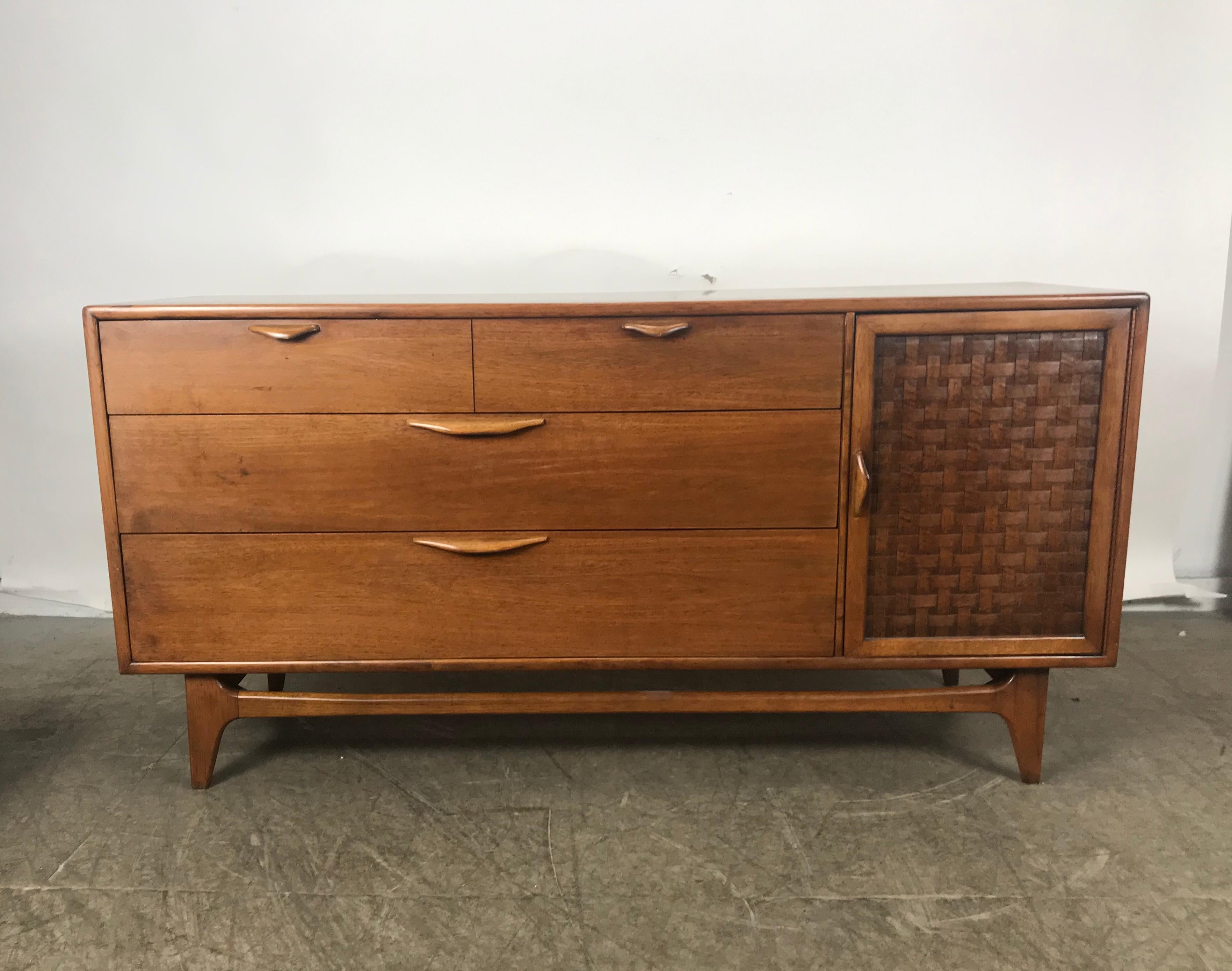 Classic Mid-Century Modern walnut server by Warren Church for lane, wonderful warm walnut patina, sculpted wood hand pulls. Four generous drawers, dovetail joinery, basket weave door with additional drawer. Retains original silverware drawer,