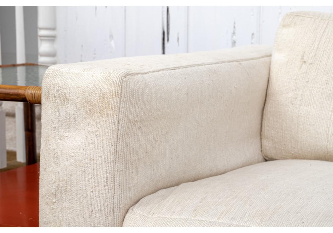 A Tuxedo Style Loveseat upholstered in an Indian Cotton Slub Weave fabric which has a fantastic natural texture and feel. Thayer Coggin quality with detached back and seat pillows. Very comfortable and solid feeling. 
The Loveseat measures 60” wide