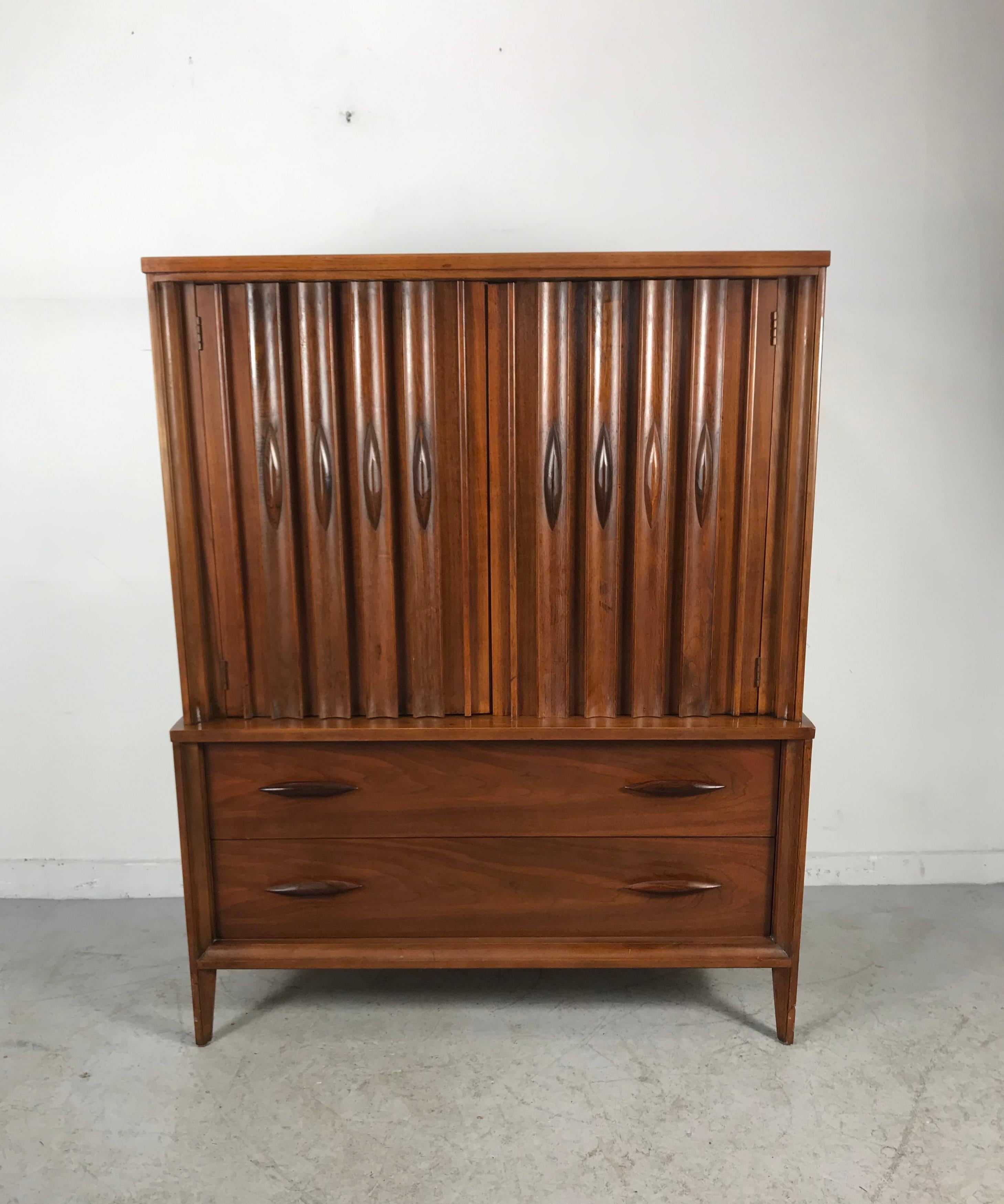 Classic Mid-Century Modern sculpted walnut and rosewood 6 drawer chest with doors. Manufactured by Vaughan Designs, superior quality and construction, dove-tail joinery, divided drawers, jewelry compartments, stunning figured wood graining, sculpted