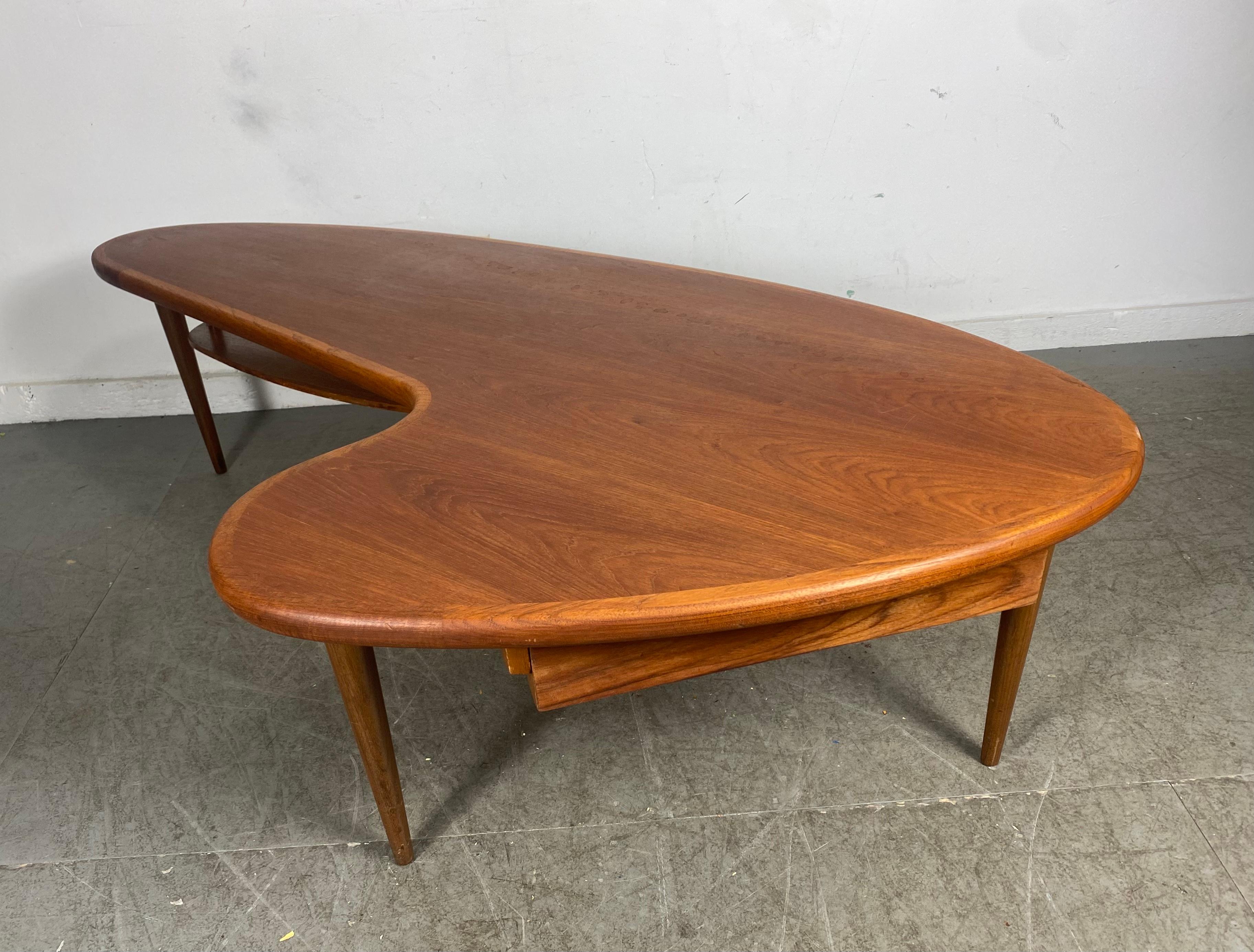 Classic midcentury walnut Boomerang coffee / cocktail table with drawer.Wonderful design,,proportion, patina,, swing out drawer,Hand delivery avail to New York City or anywhere en route from Buffalo NY.
