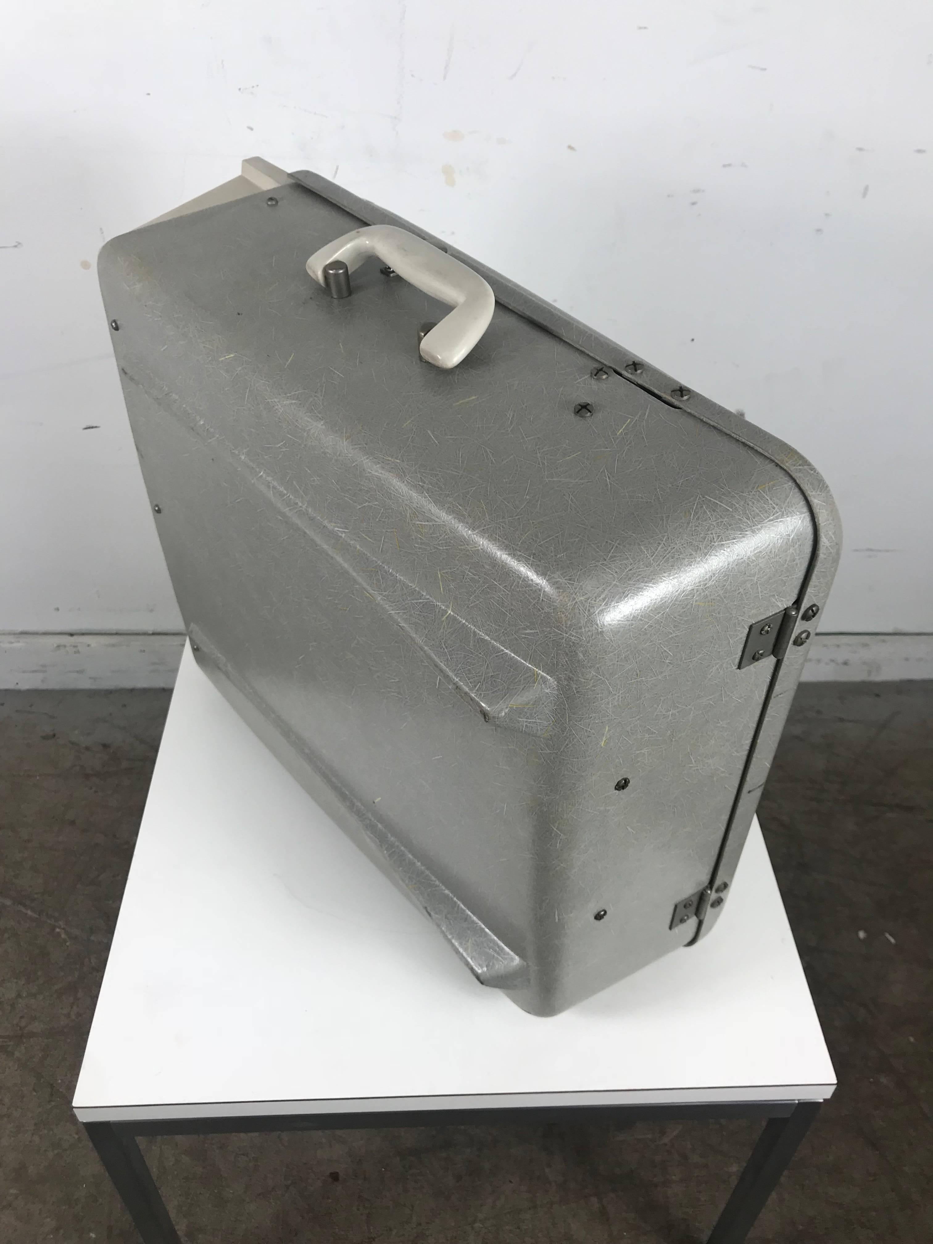 Classic midcentury silvertone syntronic fiberglass portable suitcase record player and radio, elusive exposed fiberglass outer shell body, reminiscent of Classic Charles Eames elephant hide zenith arm shell chairs, amazing condition! Record player