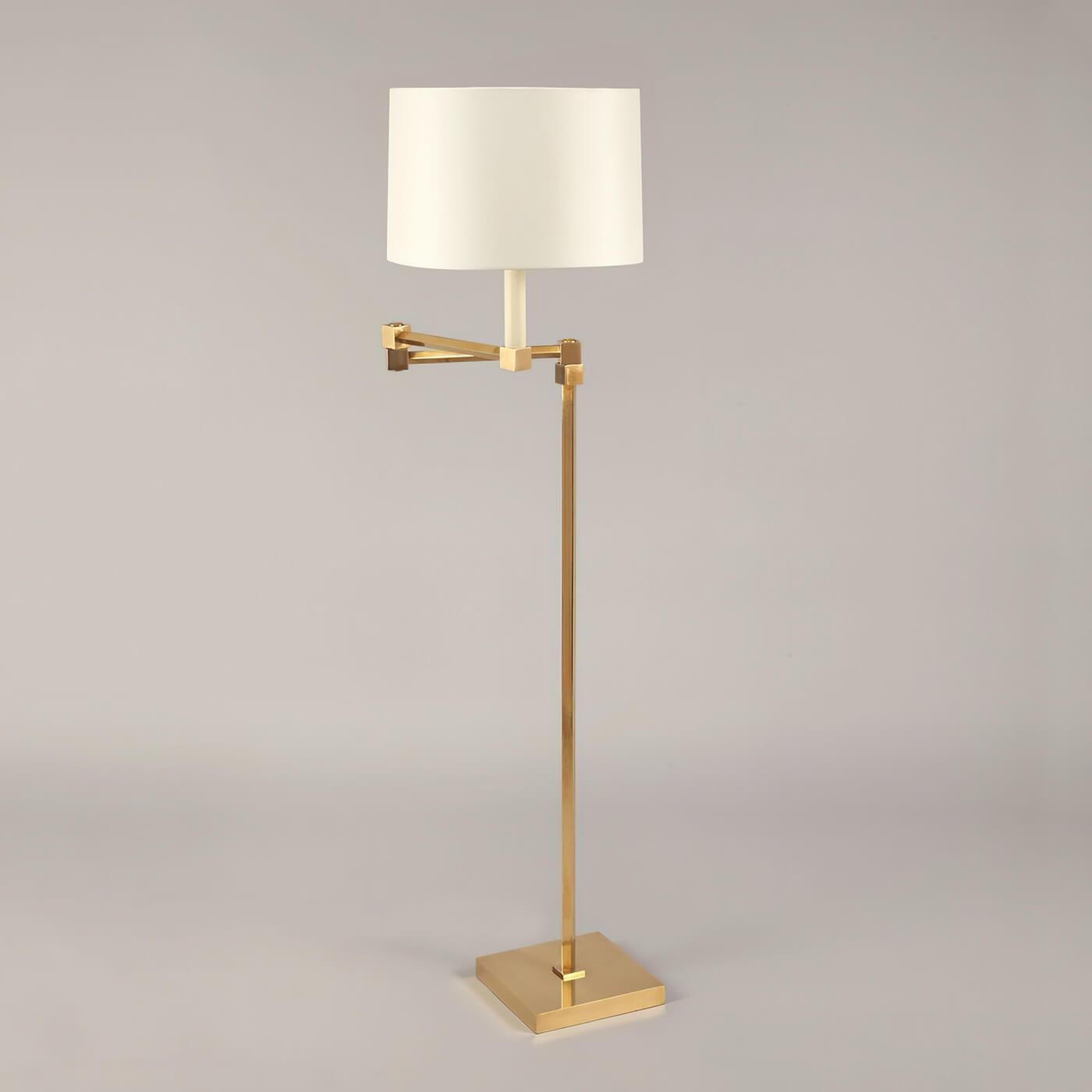 Classic Modern brass floor lamp, defined by its strong, cube-shaped design and square base, this floor lamp has universal appeal. The adjustable arm has cubed joints, which mirror the square candle holder.

The base material is solid cast brass