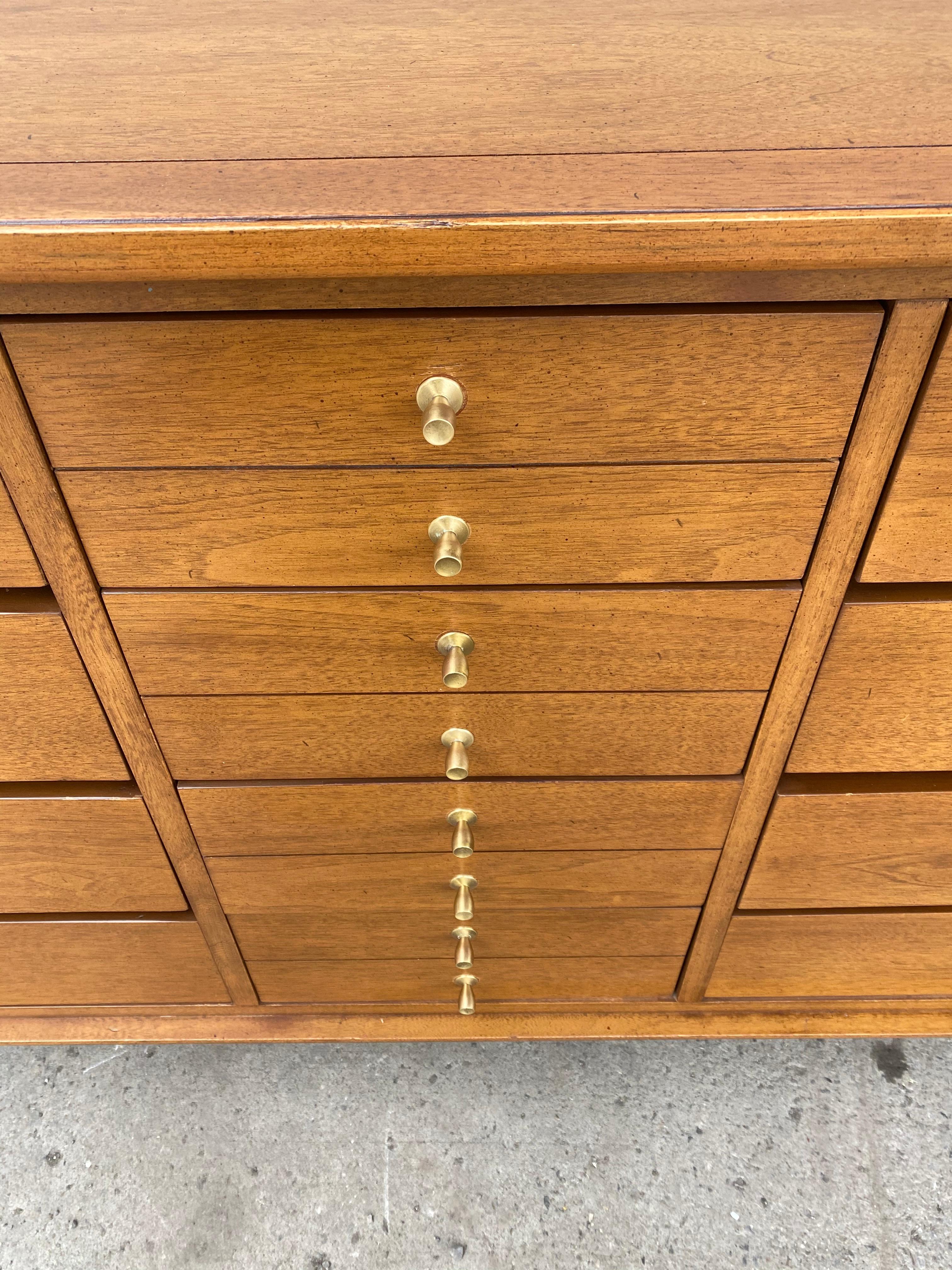 Classic modernist 12-drawer dresser by Lane, Classic Mid-Century Modern design, superior quality and construction, dove-tail drawers, beautiful brass hardware, hand delivery avail to New York City or anywhere en route from Buffalo New York.