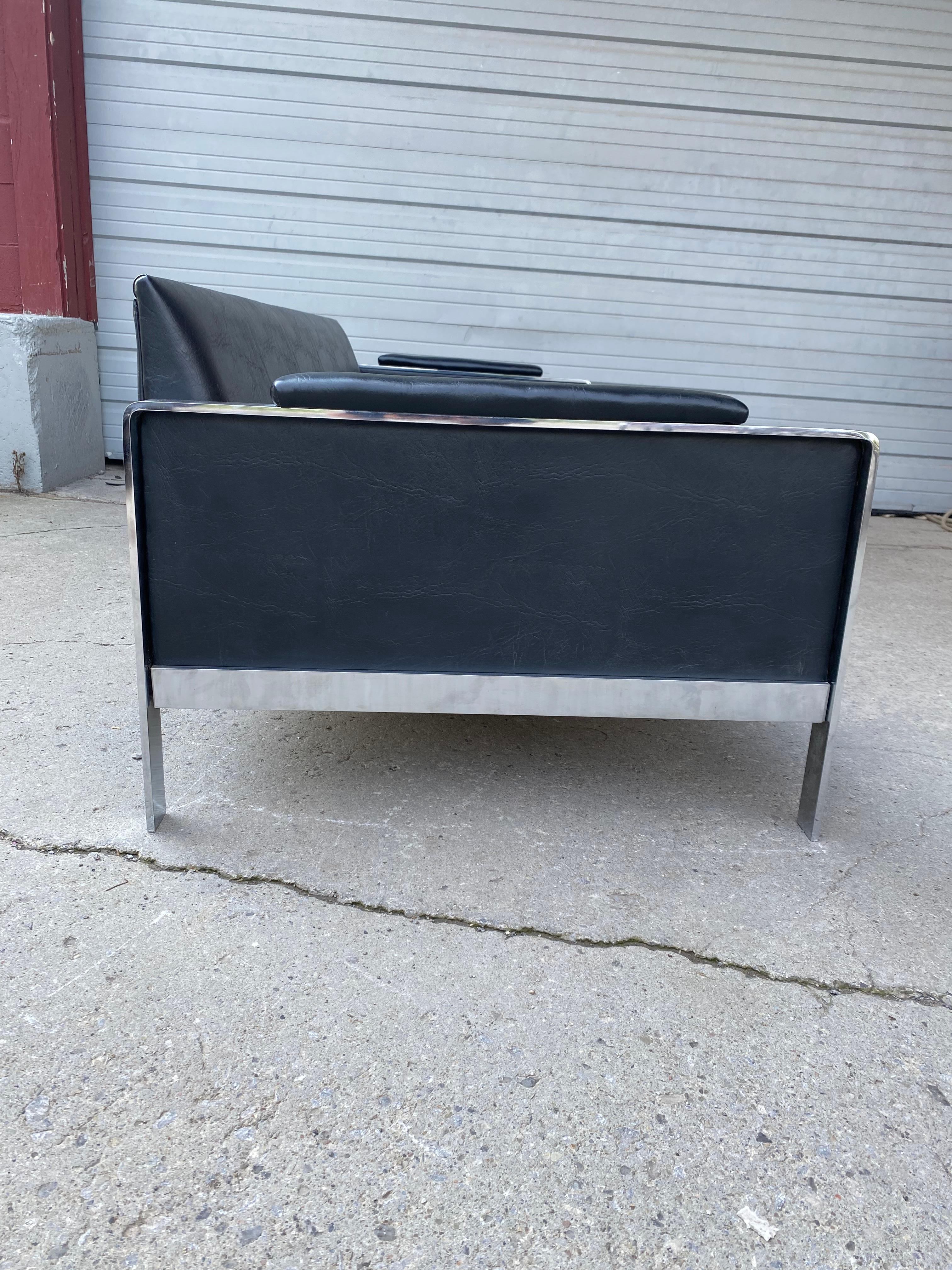 Classic Modernist Chromed steel and naugahyde low profile sofa.. attributed to Milo Baughman,,, could possibly be designed by Adrian Pearsall ?? In any event,, stunning design,/STYLE , Retains its original black and butterscotch (loose cushions)