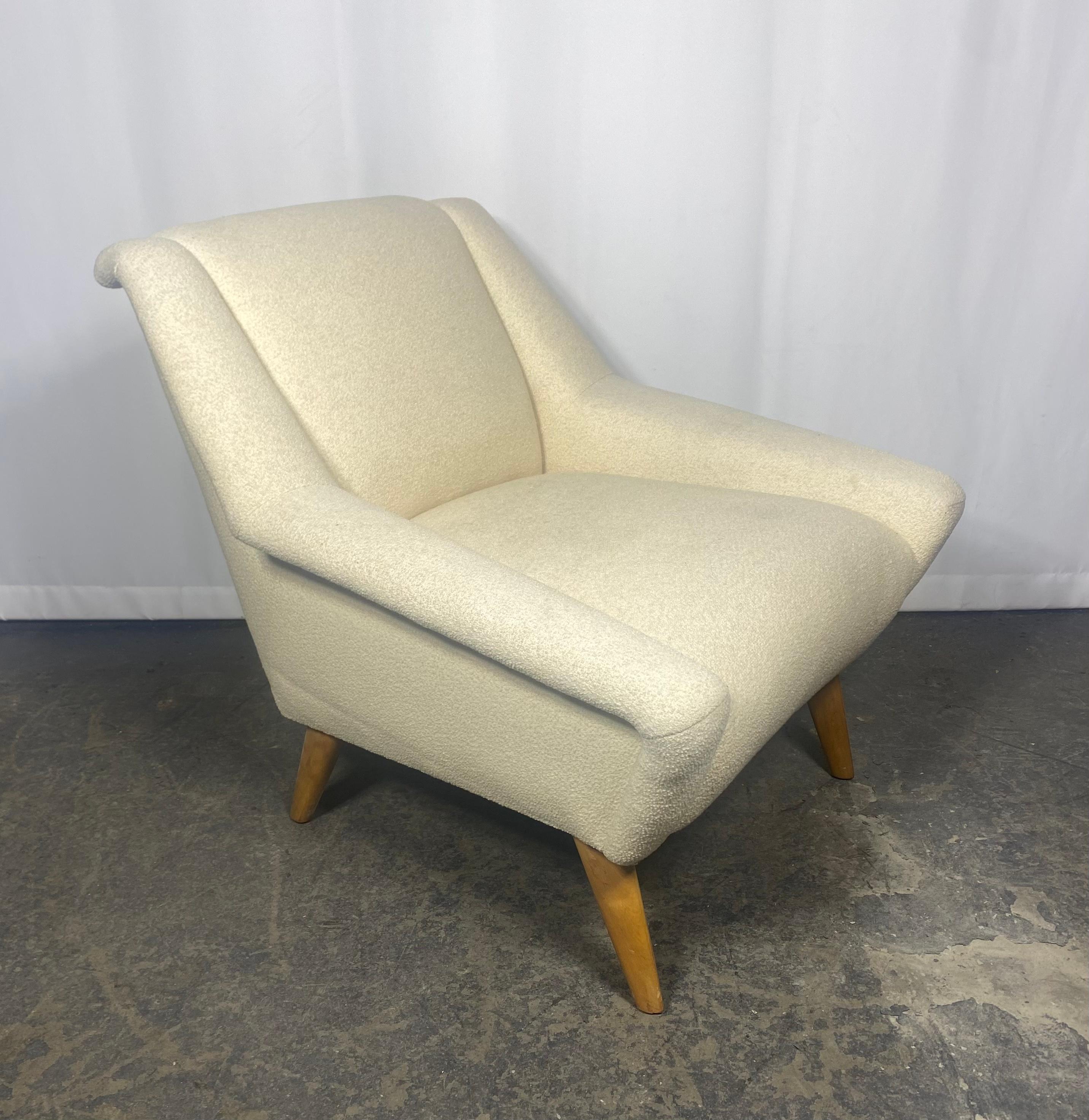 Classic Modernist Lounge Chair by Heywood Wakefield , Reminiscent of amazing designed chairs by Gio Ponti. Angular solid birch wood legs.Recently reupholstered in a nice cream /off white boucle fabric,, Extremely comfortable,Hand delivery avail to