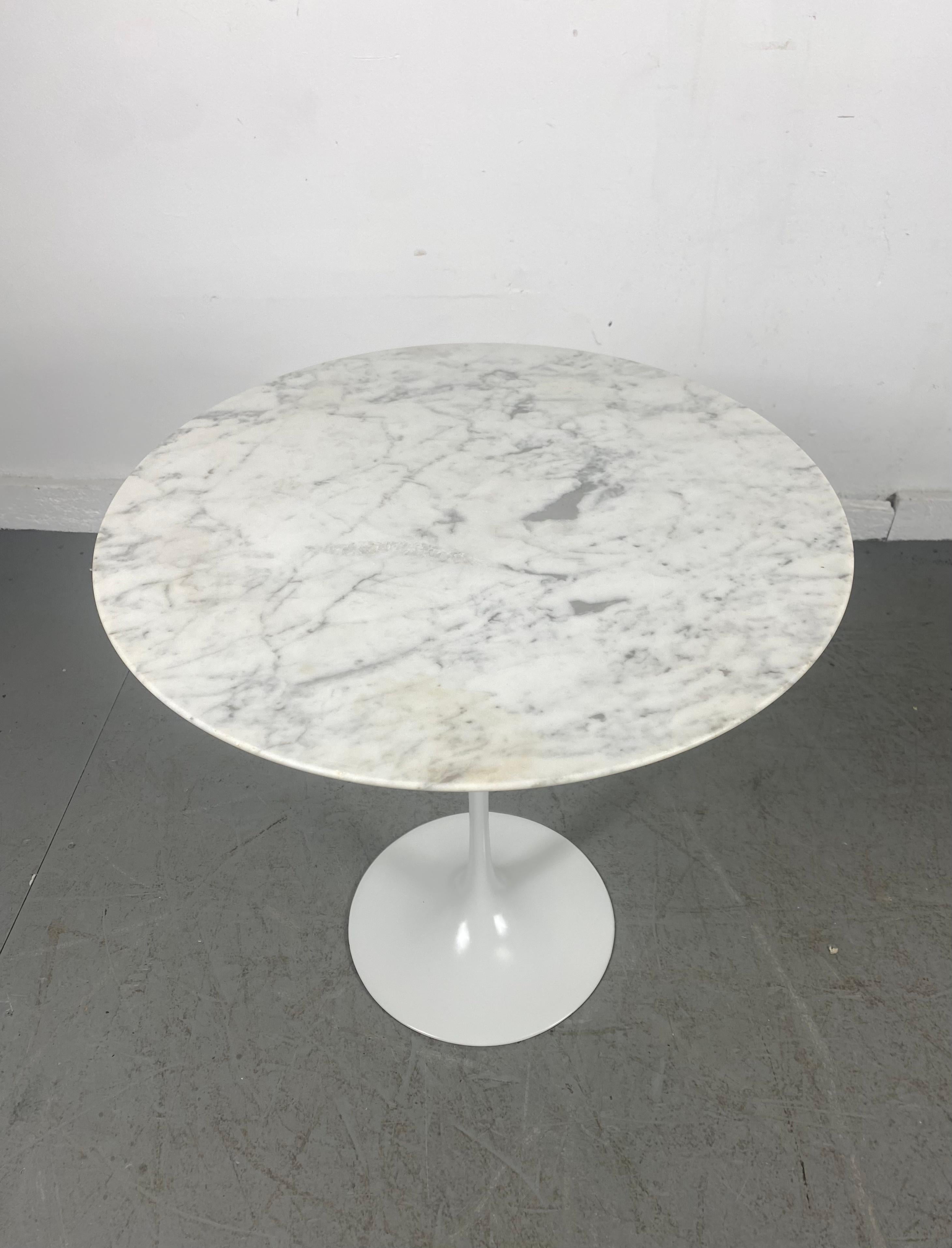 Classic Mid-Century Modern marble to tulip side table designed by Eero Saarinen for Knoll. Beautiful white Carrara marble, minor discoloration (see photo) Retains original early Knoll label.
 
