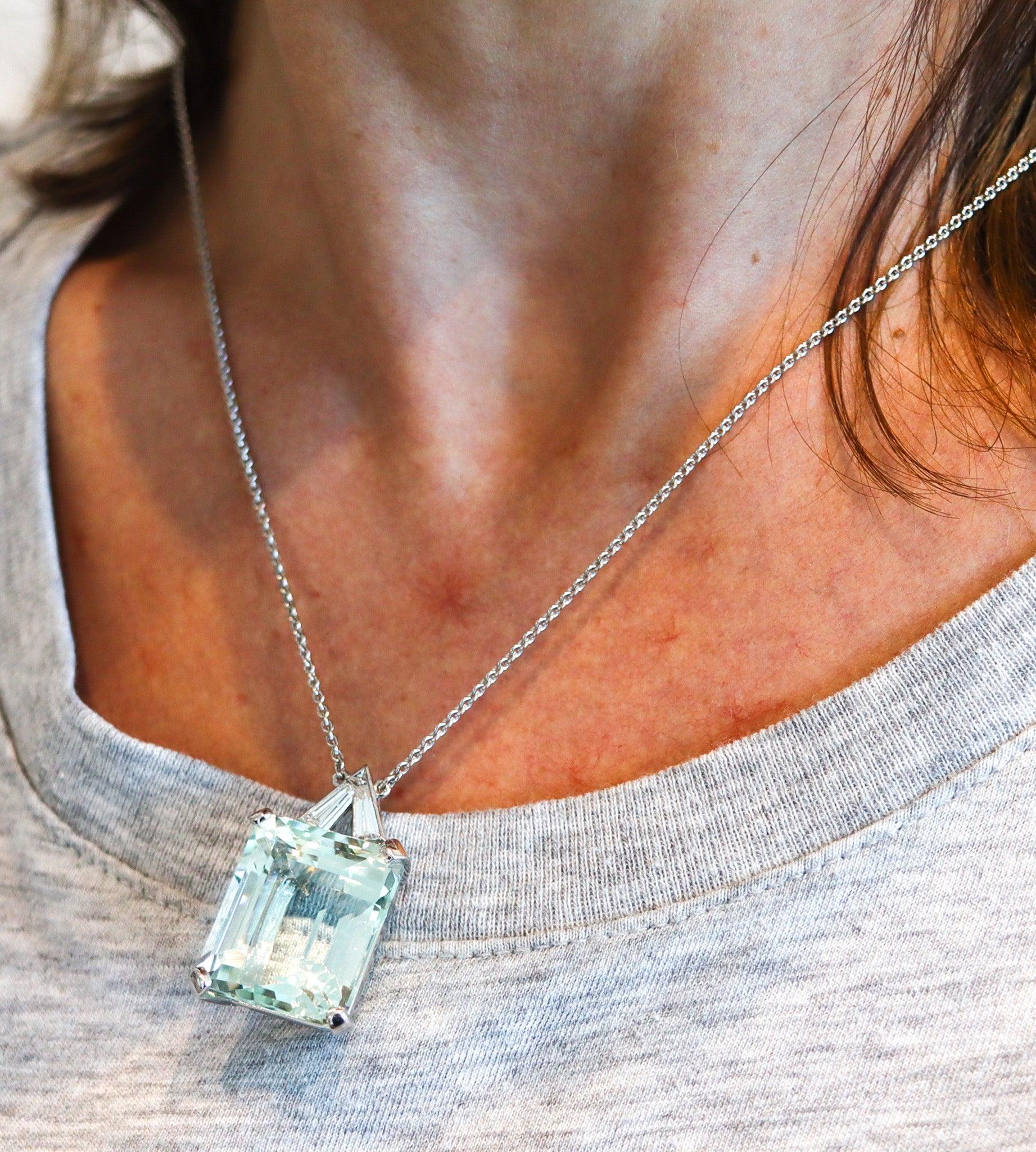 Classic necklace with aquamarine and diamonds.

This is a gorgeous classic necklace, created in America with classic patterns in solid white gold of 18 karats with high polished finish. The pendant necklace is mounted with three natural earth mined