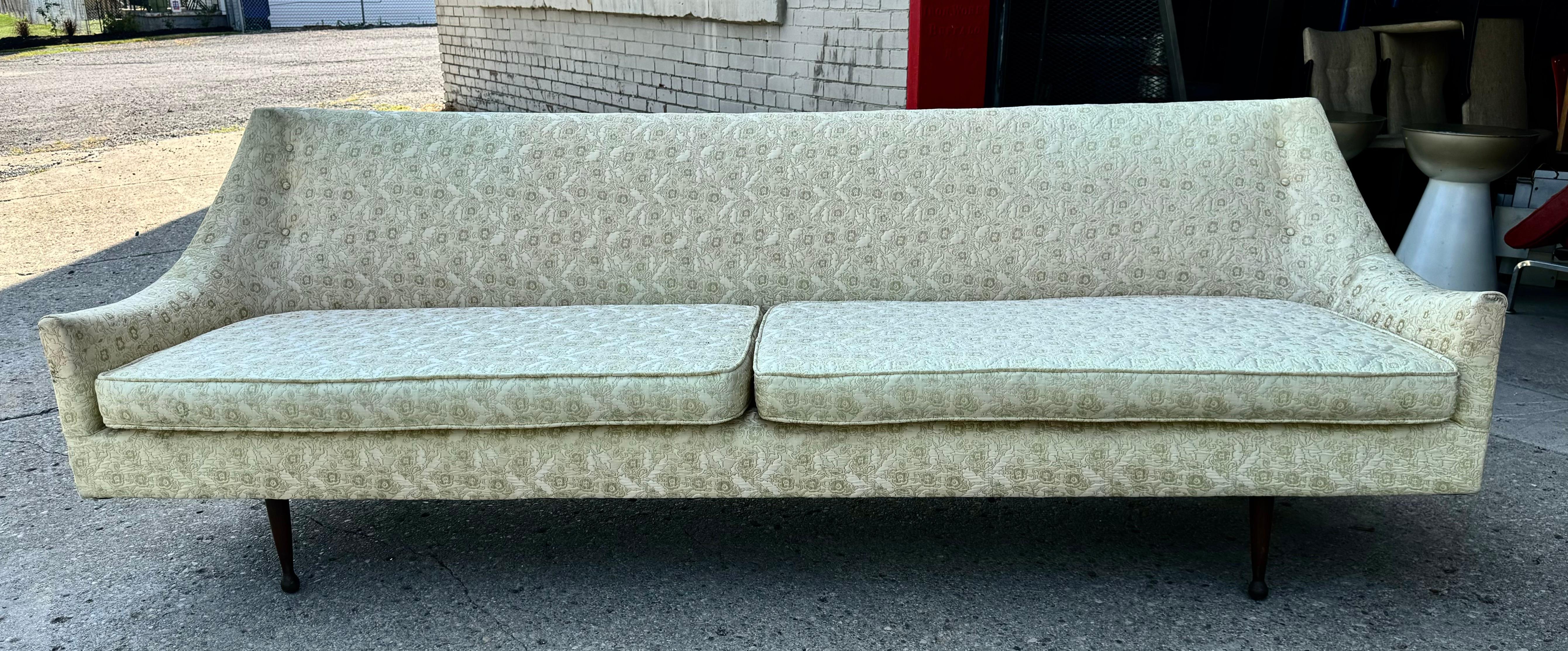 Classic Modernist Sofa attributed to Paul McCobb.. Amazing lines.. Sleek elegant design.. Reupholstered (within the last 15 years)..in an ivory mattelasse fabric.. Nice useable condition but would be amazing reupholstered.. Superior quality and