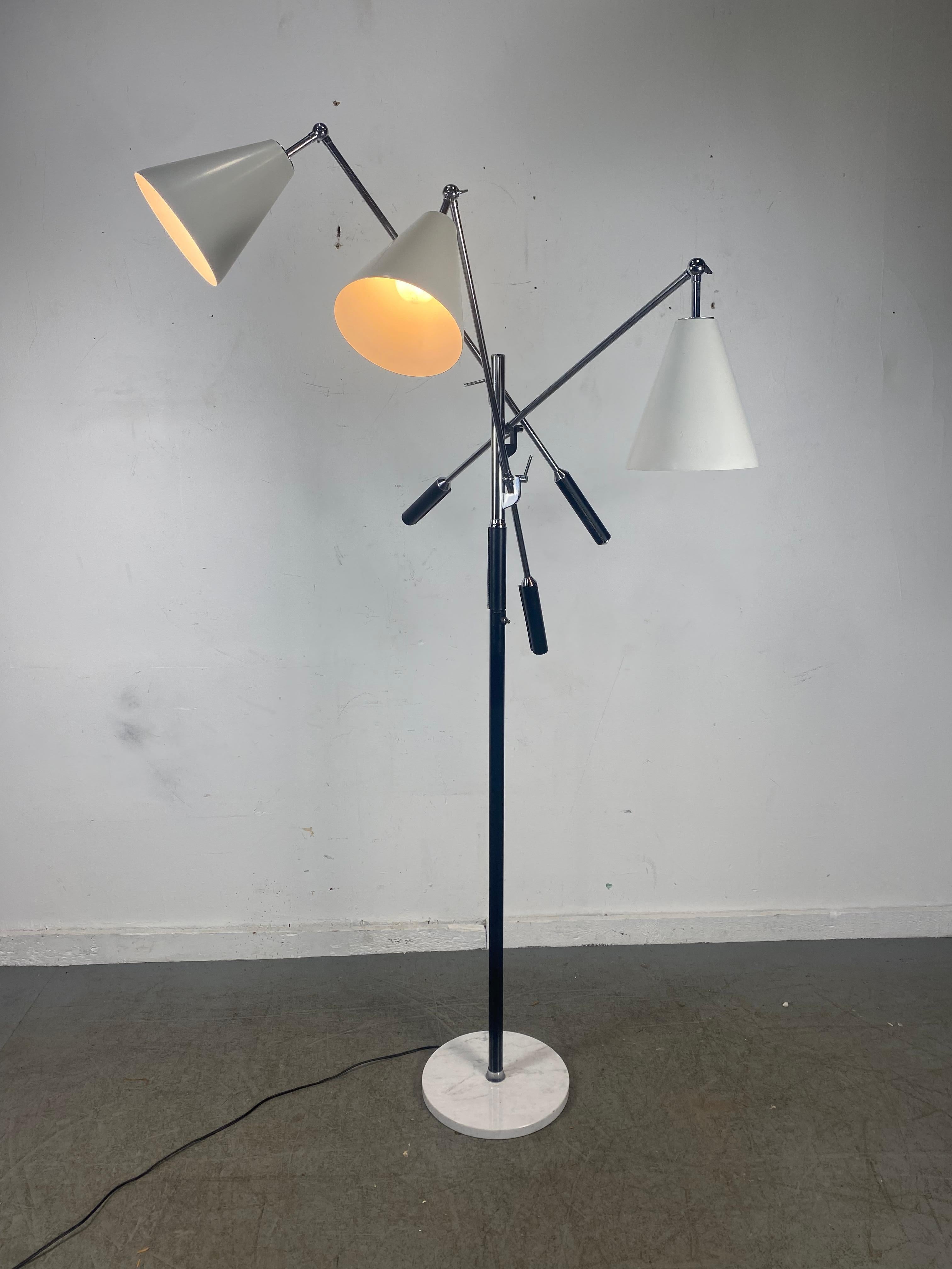 Mid-Century Modern triple arm floor lamp designed by Angelo Lelli, made in Italy, Classic version, white cone shades. Chrome standard, Leather wrapped weighted ends, leather standard, stunning white carrara marble base. Lamp in amazing original
