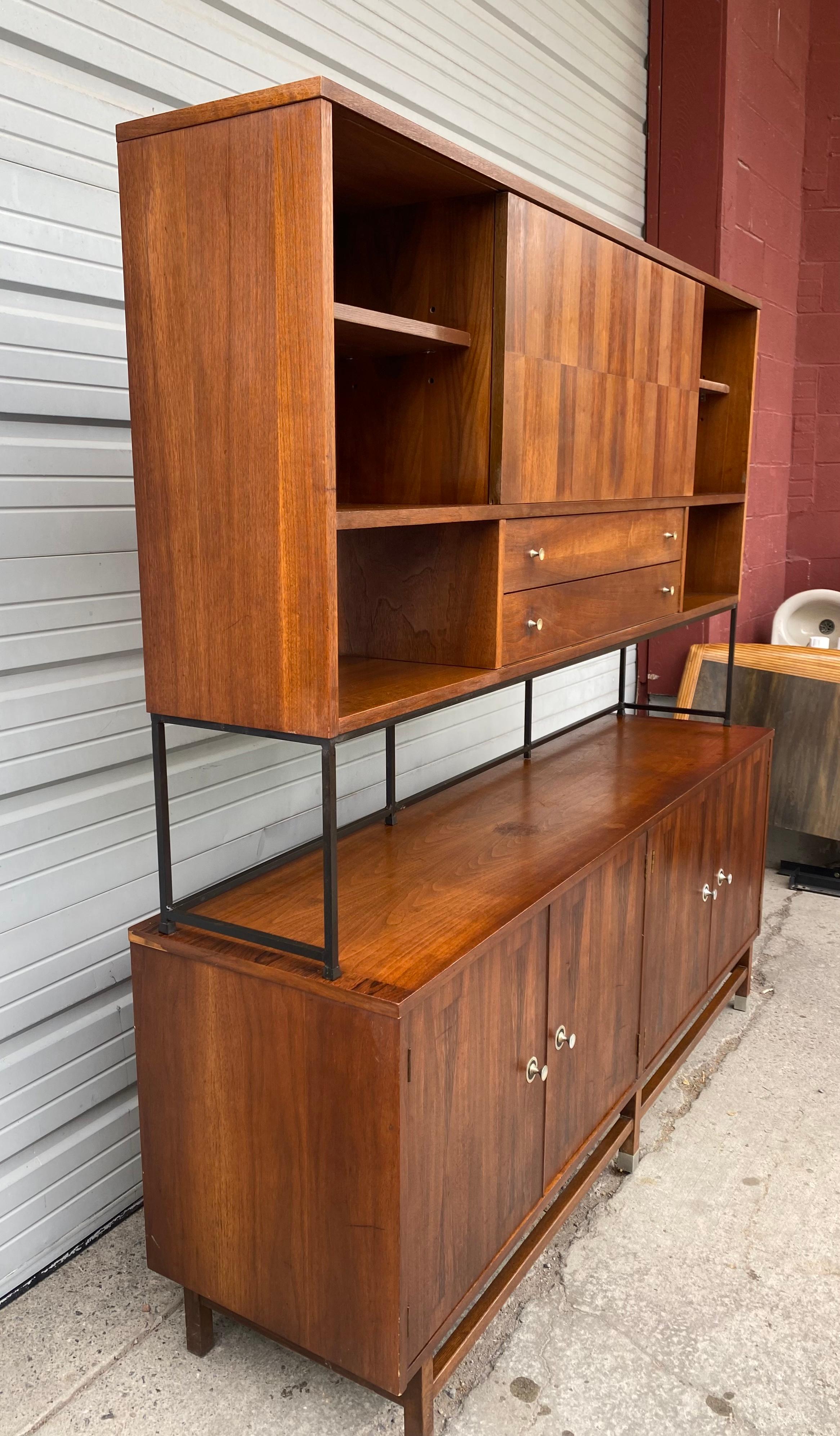 Classic Modernist wall unit long credenza /top by Stanley in Walnut and Rosewood,,,Amazing design.Generous storage...Iron frame top ,,two sliding doors and drawers,,Bottom credenza,,(left) ,shelves ,,(right) ,,three drawers including silverware