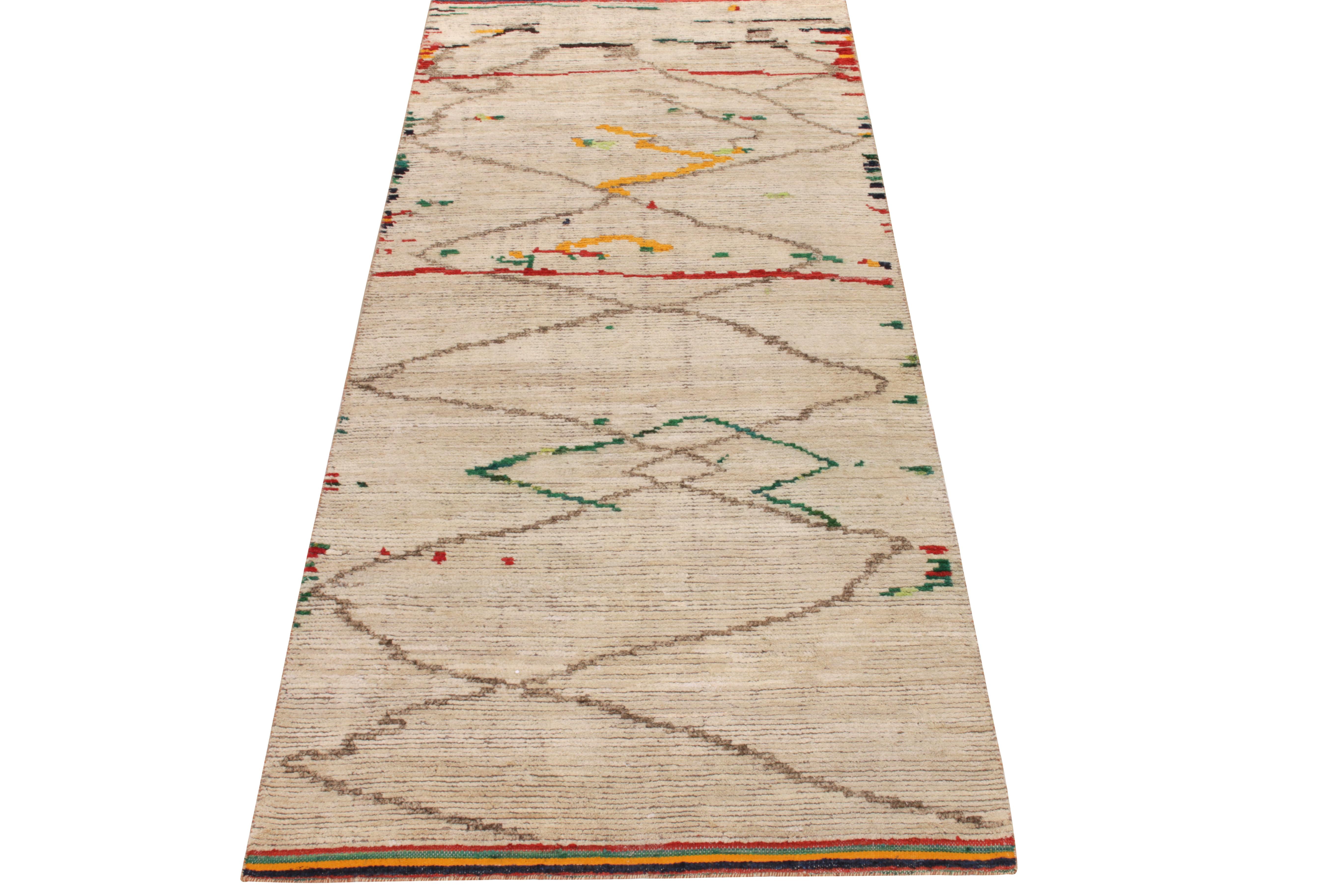 Rug & Kilim’s original ode to Moroccan rug design, carrying a luscious healthy pile in creamy beige comfortably mothering a defined geometric pattern in muted brown tones. The tribal aesthetics of this style enjoy a joyful play of crimson red,