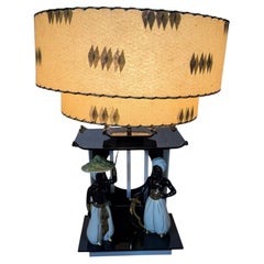 Classic MOSS Lucite lamp /seldom seen Nubian figures /two-tier parchment shade