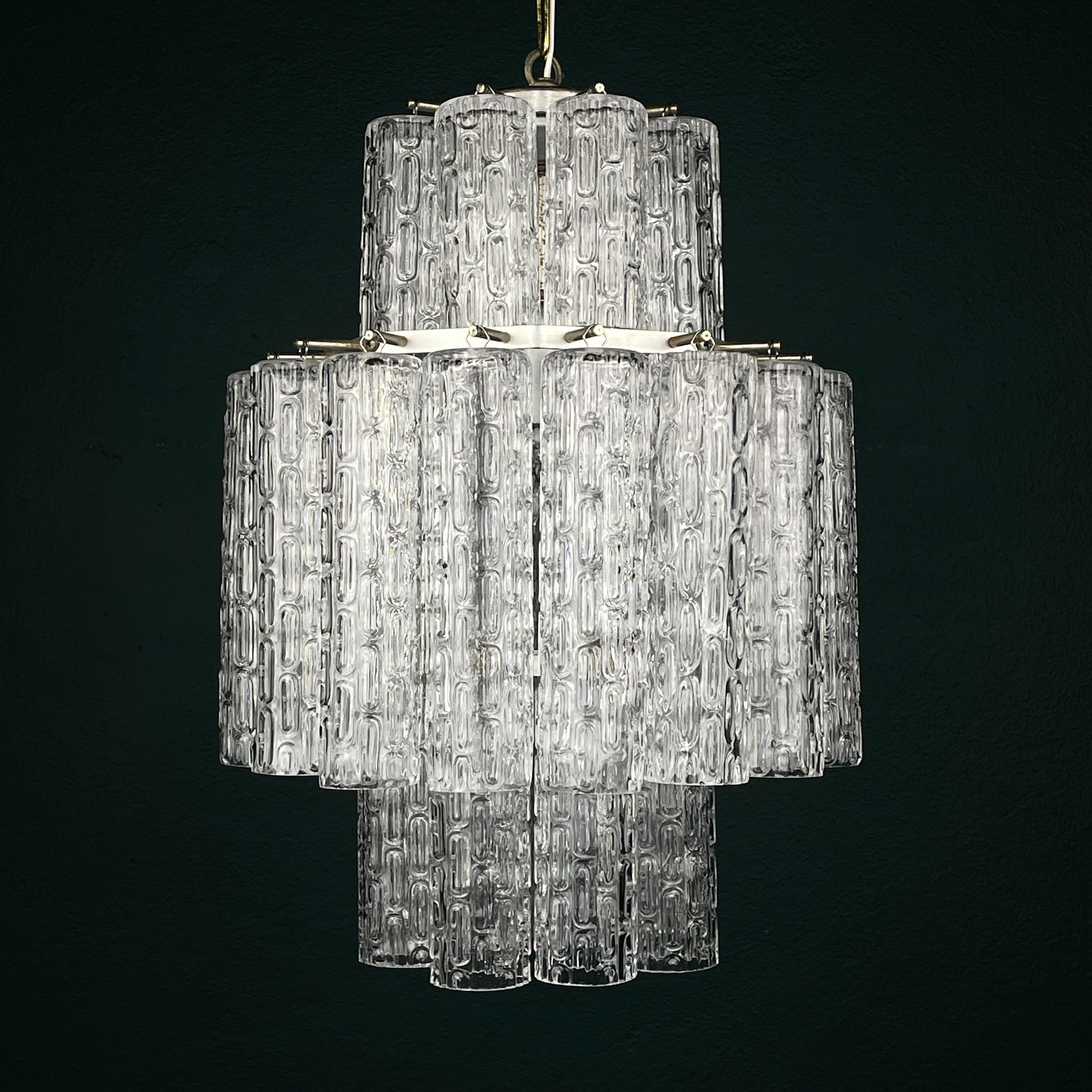 Original vintage Murano chandelier Tronchi by Venini made in Italy in the 1960s.
Venini & Co. played a leading role in the revival of Italy’s high-end glass industry, pairing innovative modernist designers with the skilled artisans in the