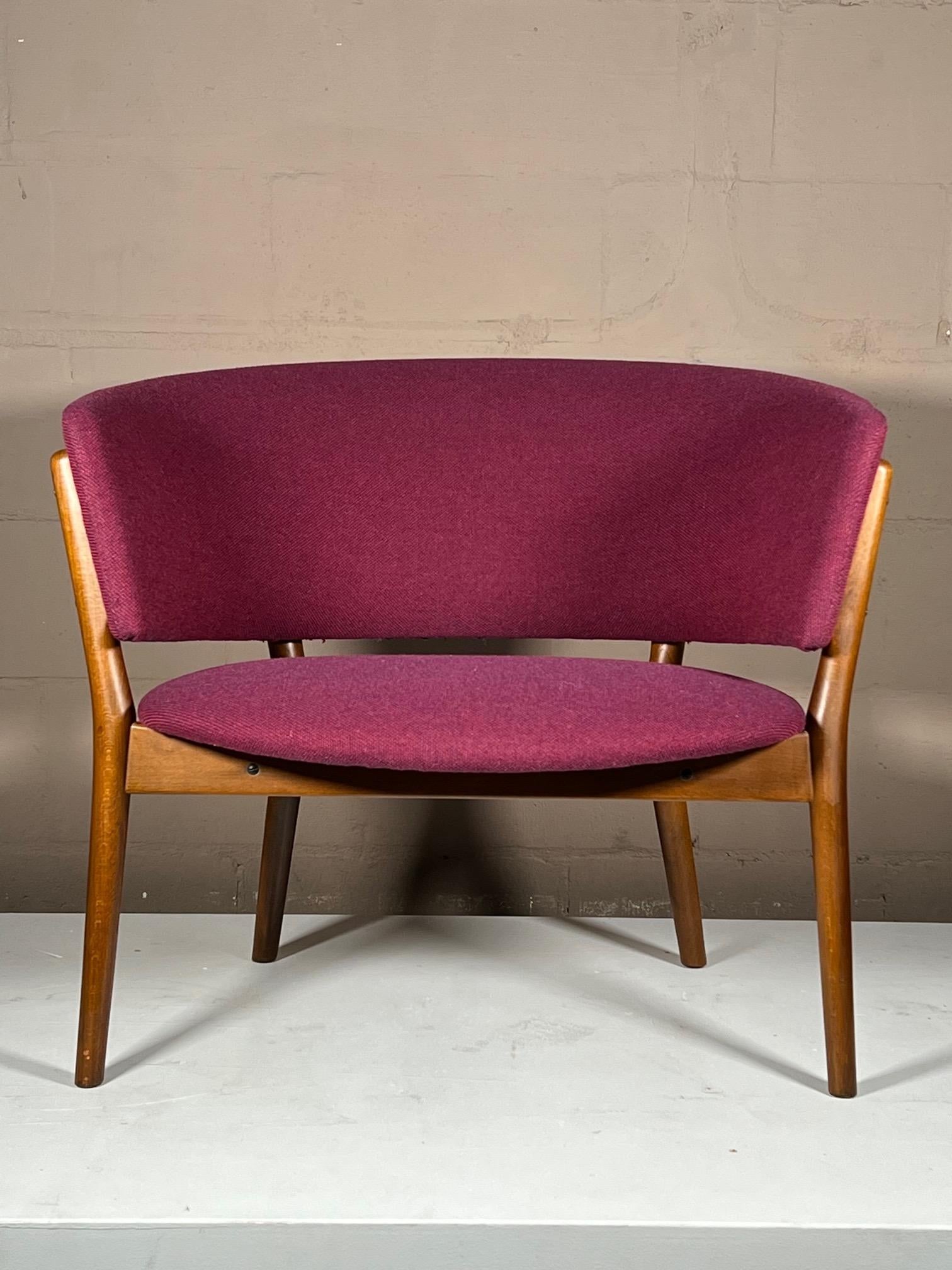 A classic barrel chair known as the ND83, designed by Nanna Ditzel, made by Søren Willadsen, in Denmark and distributed by Selig in the USA. Beechwood with original upholstery.