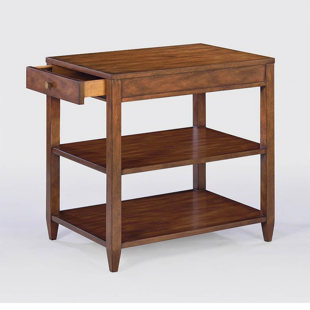 Classic narrow rectangle side table with a drawer, two shelves, brass hardware, and tapered teen, has a “rustic” warm walnut finish with subtle visual distressing and hand-rubbed finish.

Dimensions: 26