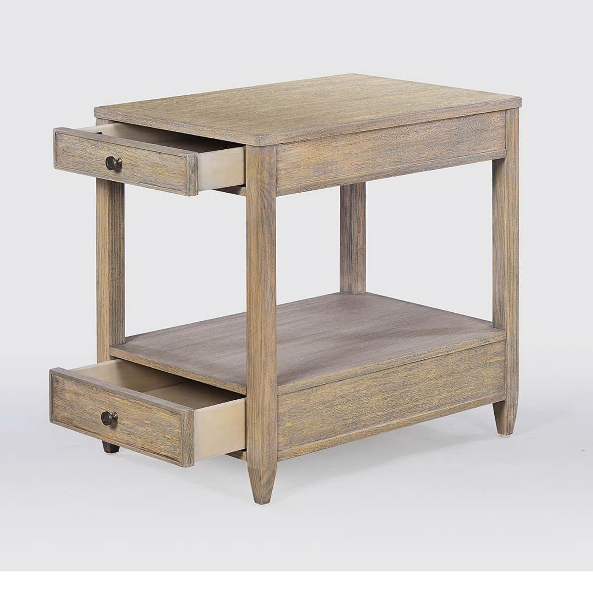 Classic narrow rectangle side table with two drawers, brass hardware, and tapered feet, with a “rustic” warm walnut finish with subtle visual distressing and hand-rubbed finish.

Dimensions: 18