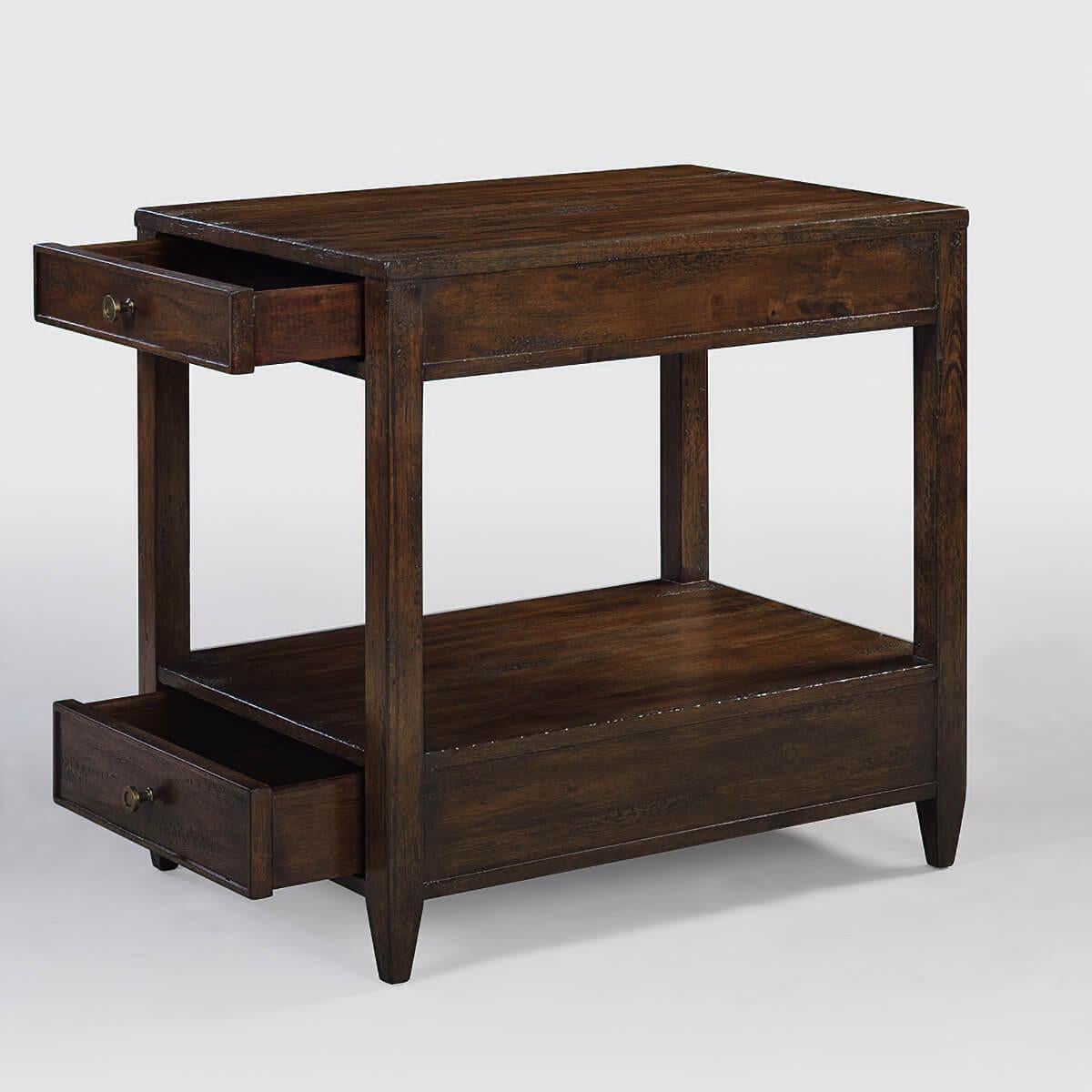 Classic narrow rectangle side table with two drawers, brass hardware, and tapered feet, with a “country” dark mahogany tone with natural highlights, a hand-rubbed and distressed antiqued finish.

Dimensions: 18