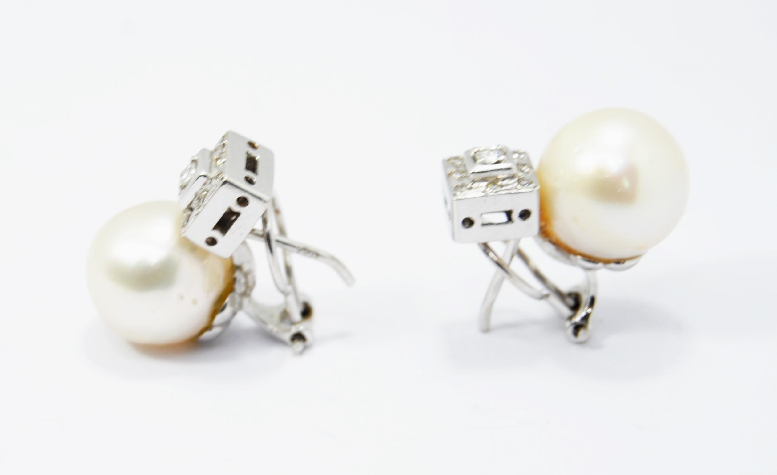 Sleekly crafted in  18K white gold these romantic and chic clip-on earrings consist on cultivated pearls with a carré of diamonds perfect for every day and for special occasions. A chic, high-style sparkler, handmade Spain  
Cultivated 12mm pearl