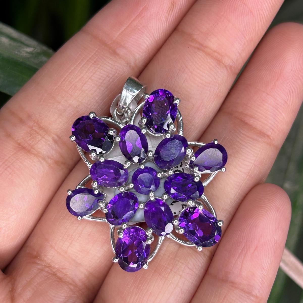 Classic 12.45 ct Natural Amethyst Cluster Pendant in sterling silver studded with round cut amethyst. This stunning piece of jewelry instantly elevates a casual look or dressy outfit. 
Amethyst enhances the intellectual capacity of the