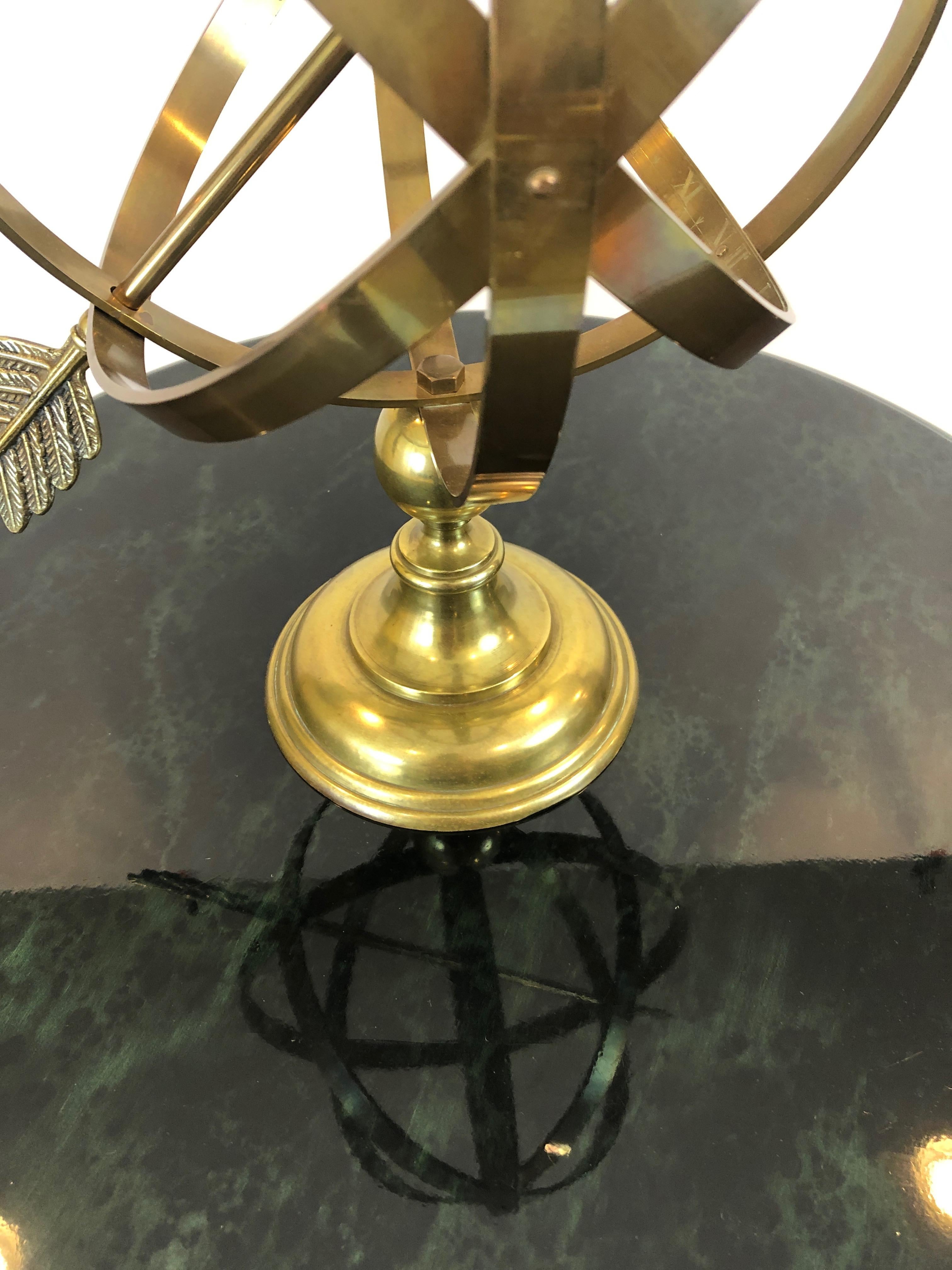A wonderful table top or desk accessory found in this stunning brass armillary having neoclassical style, arrow piercing the round armature, and Roman numerals etched on the interior of the brass.
Measures: Arrow from tip to tip 16
Diameter of