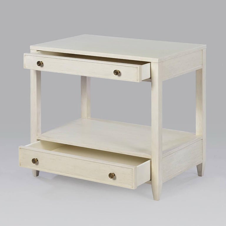 Classic nightstand, a wide rectangle side table with two drawers, brass hardware, and tapered feet, has a “drift” white painted finish with subtle grey distressing.

Dimensions: 28