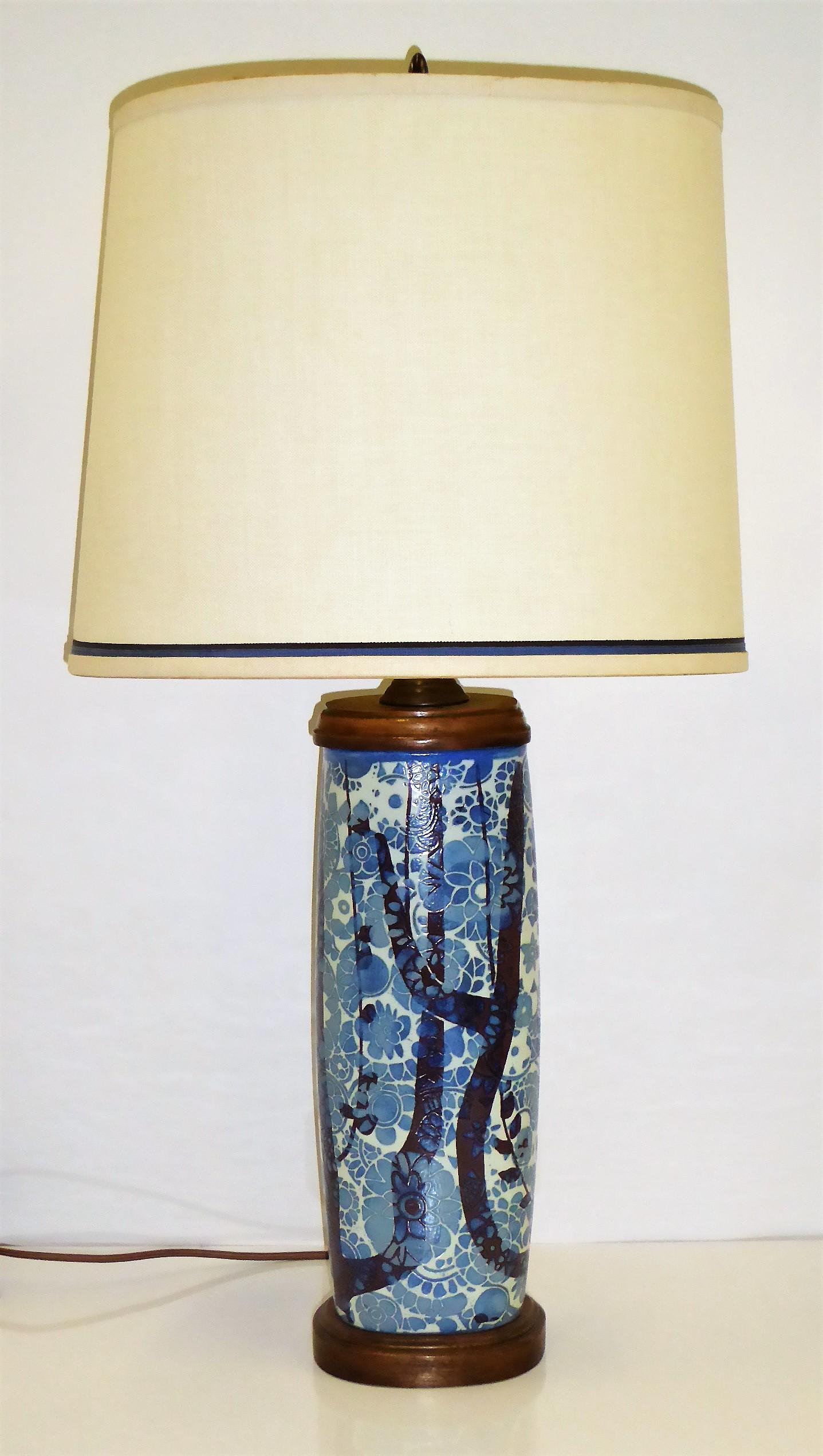 An elegant and Classic Danish vase exquisitely mounted as a table lamp. Nils Thorsson created the Baca series of pottery for Aluminia/Royal Copenhagen and on this particular form of vase from 1965, the artist Johanne Gerber designed the wood &