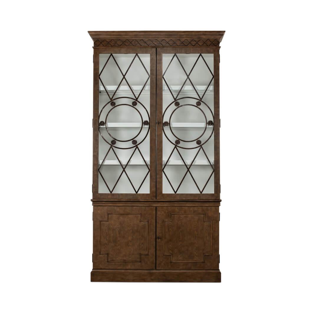 This stately cabinet, finished in a rich, light mink oak finish, exudes an air of aristocratic elegance and timeless appeal.

The doors are graced with cast rosettes and circular bands within the door grille, providing a touch of ornamental beauty