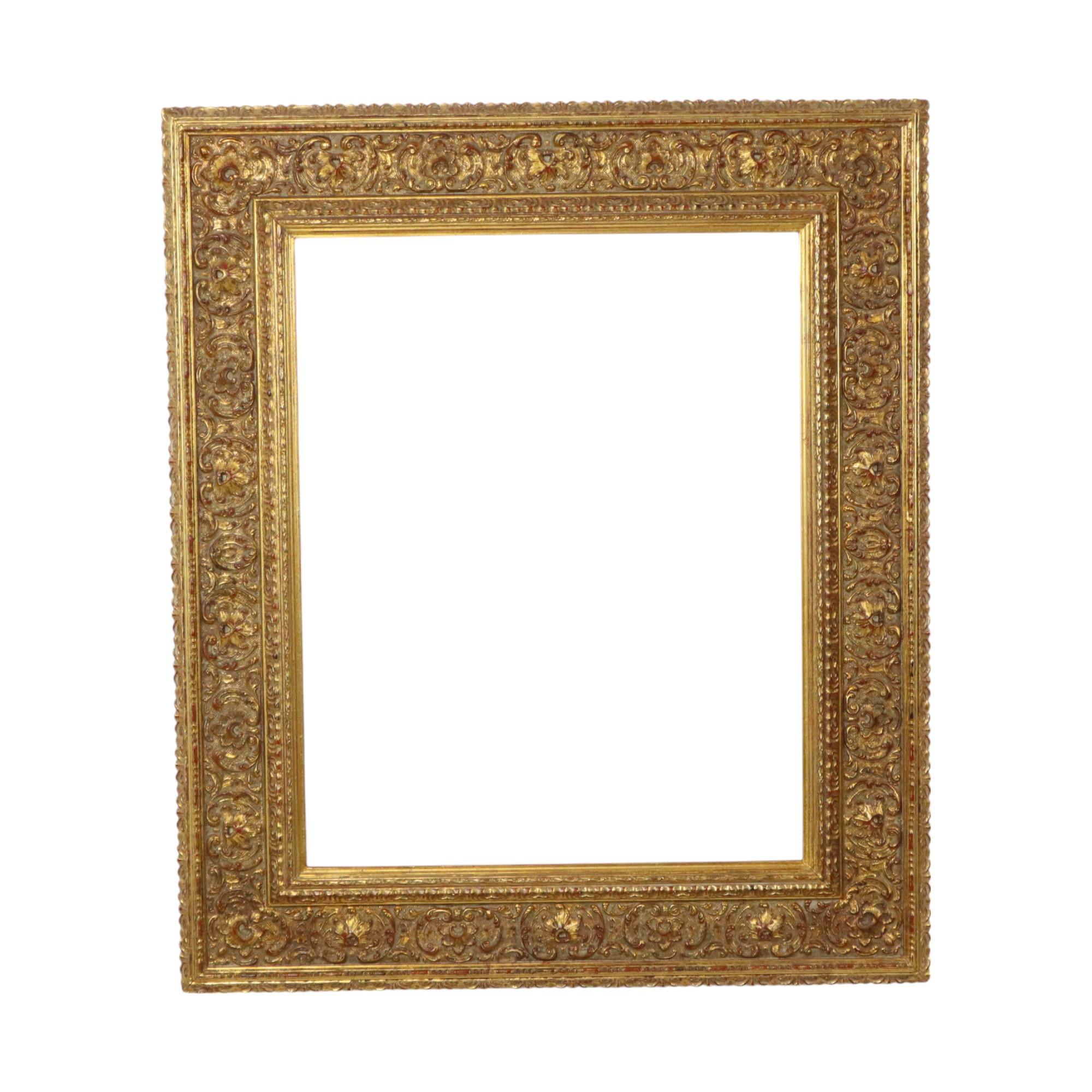 This old wooden gold-colored frame with a beautiful patina, entirely in classic Baroque or Rococo style, is decorated with acanthus leaves and embossed patterns. It's a beautiful, high-quality object from the first half of the 20th century.

A