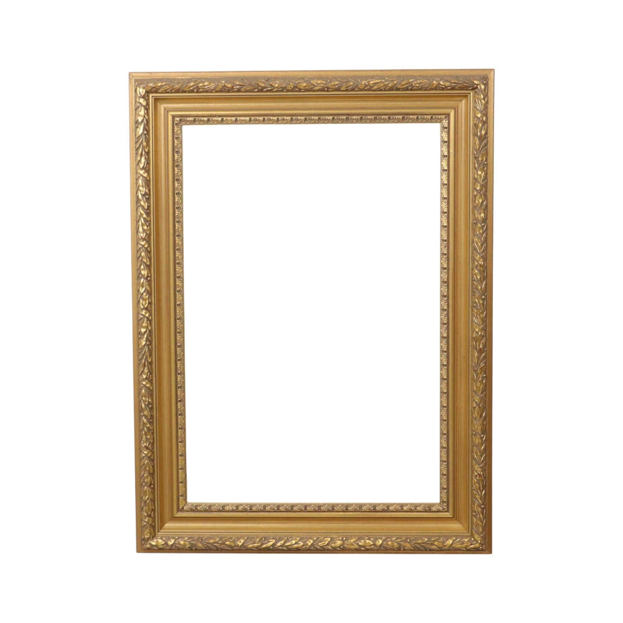 This old wooden gold-colored frame with a beautiful patina, entirely in classic Baroque or Rococo style, is decorated with acanthus leaves and embossed patterns. It's a beautiful, high-quality object from the second half to the end of the 20th