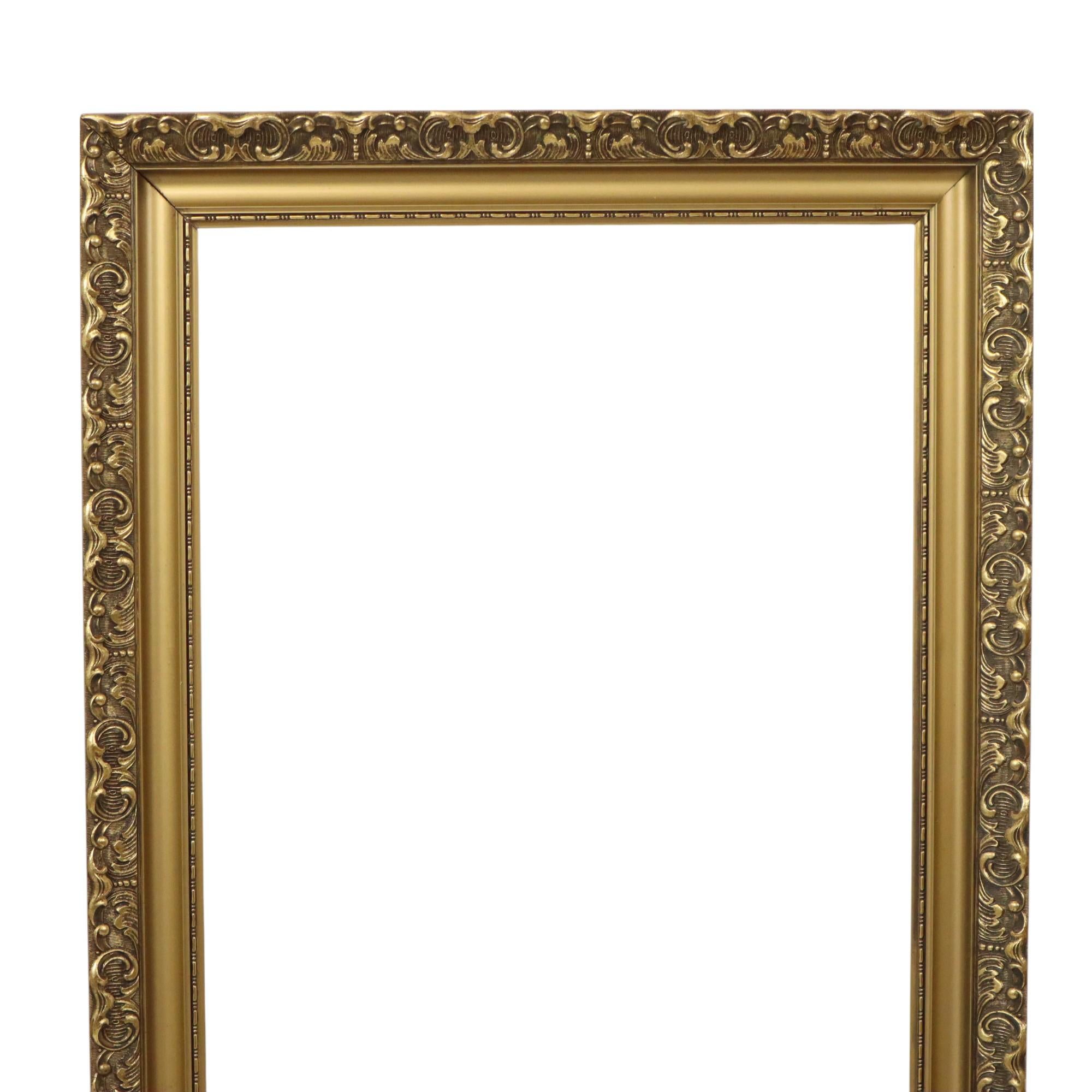 This old wooden gold-colored frame with a beautiful patina, entirely in classic Baroque or Rococo style, is decorated with acanthus leaves and embossed patterns. It's a beautiful, high-quality object from the first half of the 20th century.

A