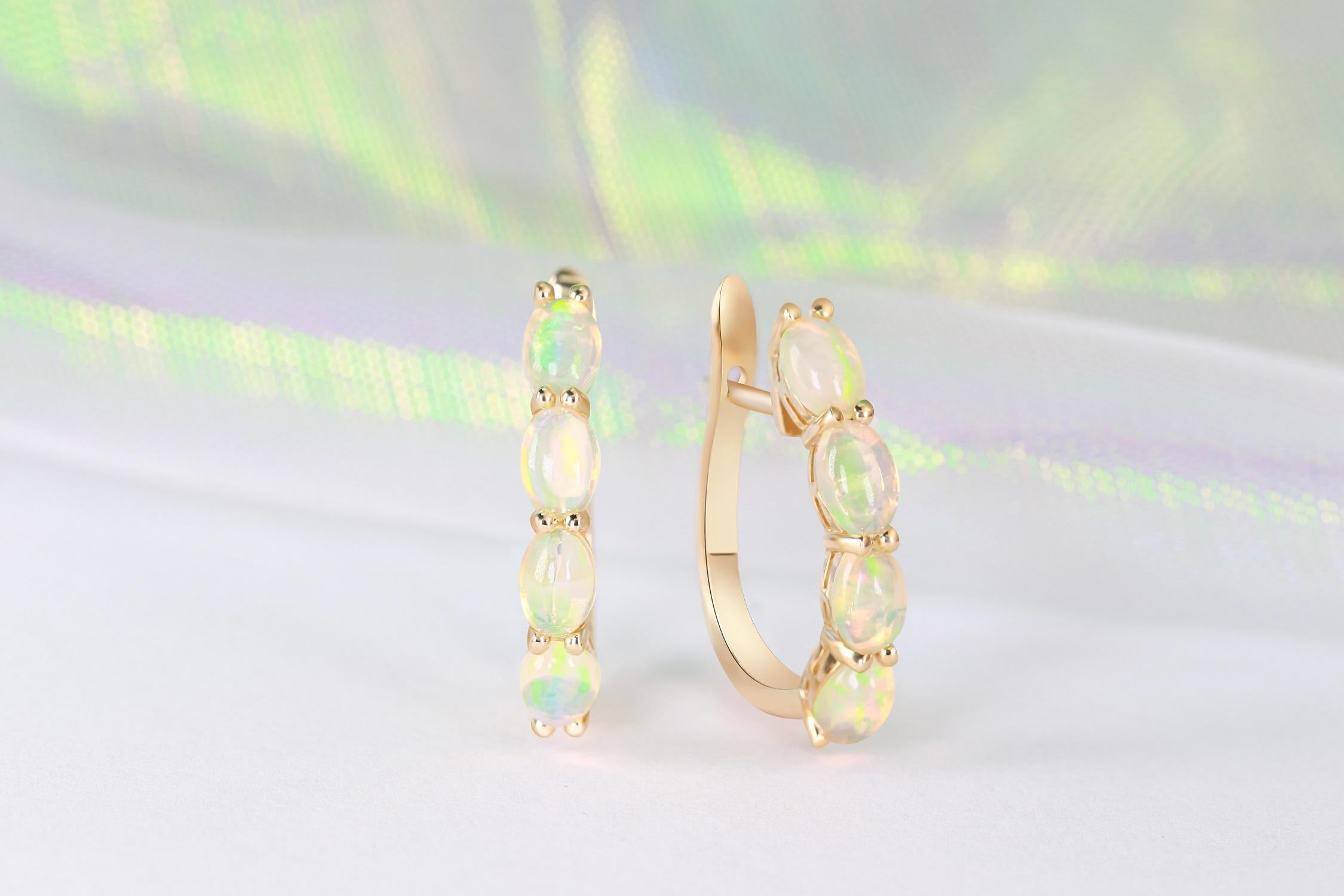 Stunning, timeless and classy eternity Unique Earring. Decorate yourself in luxury with this Gin & Grace Earring. The 14k Yellow Gold jewelry boasts Oval Cab Prong Setting Genuine 6x4 Ethiopian Opal (8 pcs) 2.37 Carat, stones for a lovely design.