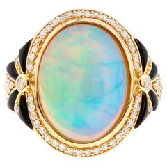 Anillo Clásico de Ópalo Etíope de Cabujón Ovalado Acentuado con Diamante Blanco de Oro Amarillo de 14k