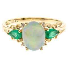 Classic Oval Cab Ethiopian Opal, Emerald and Diamond 10K Yellow Gold Ring